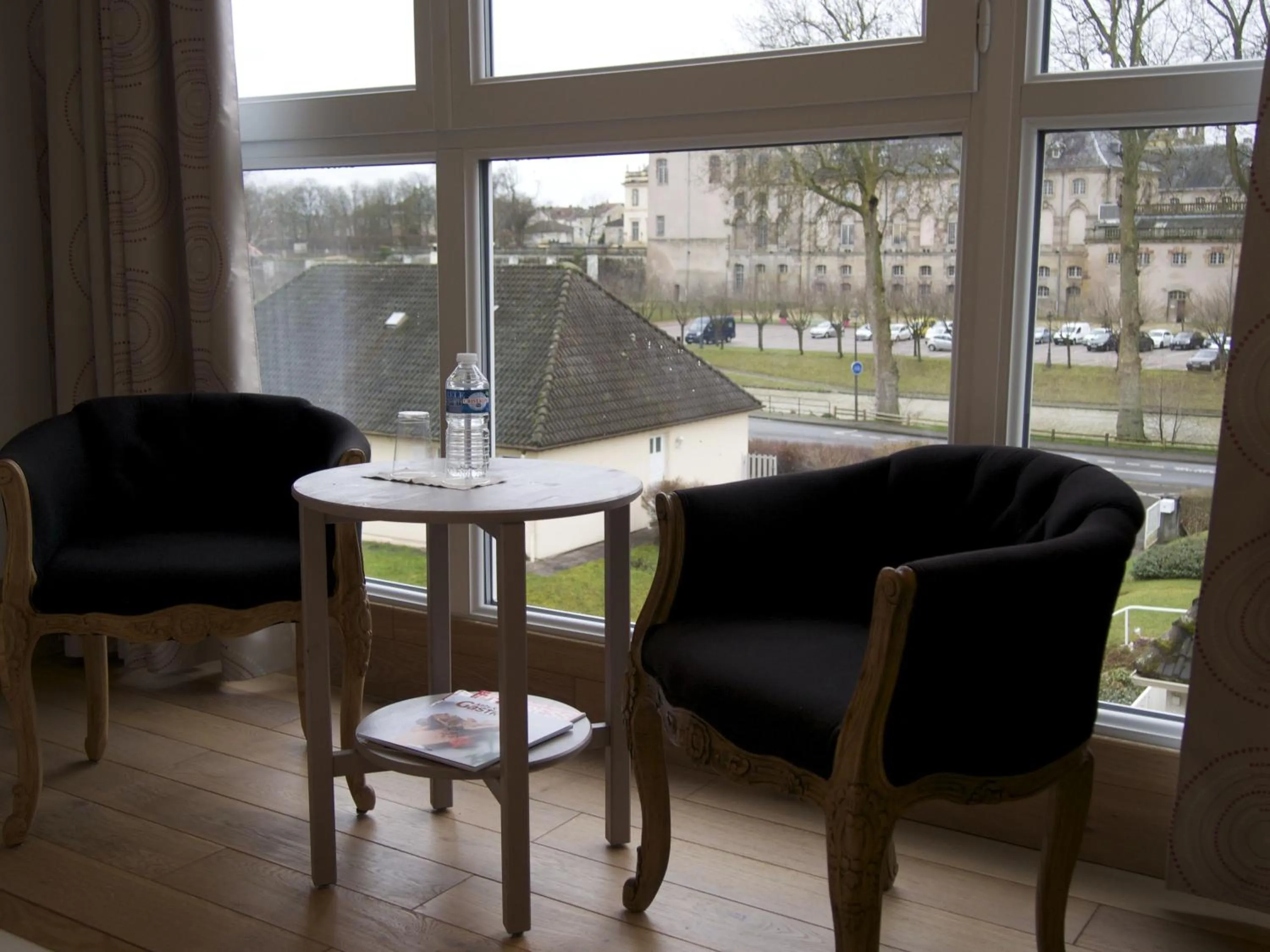Seating area in Logis Hôtel Les Pages