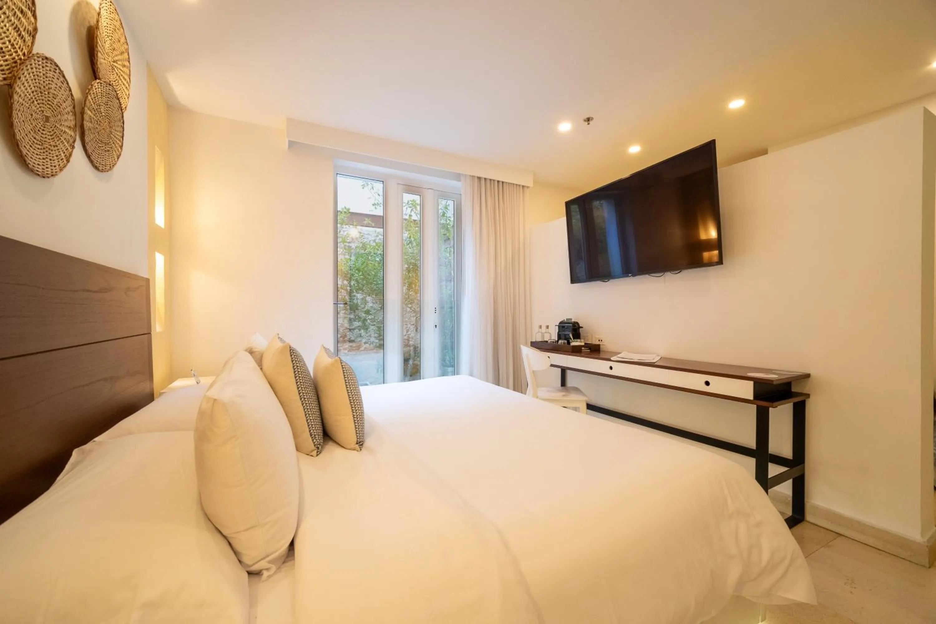 Photo of the whole room, Bed in Nacar Hotel Cartagena, Curio Collection by Hilton