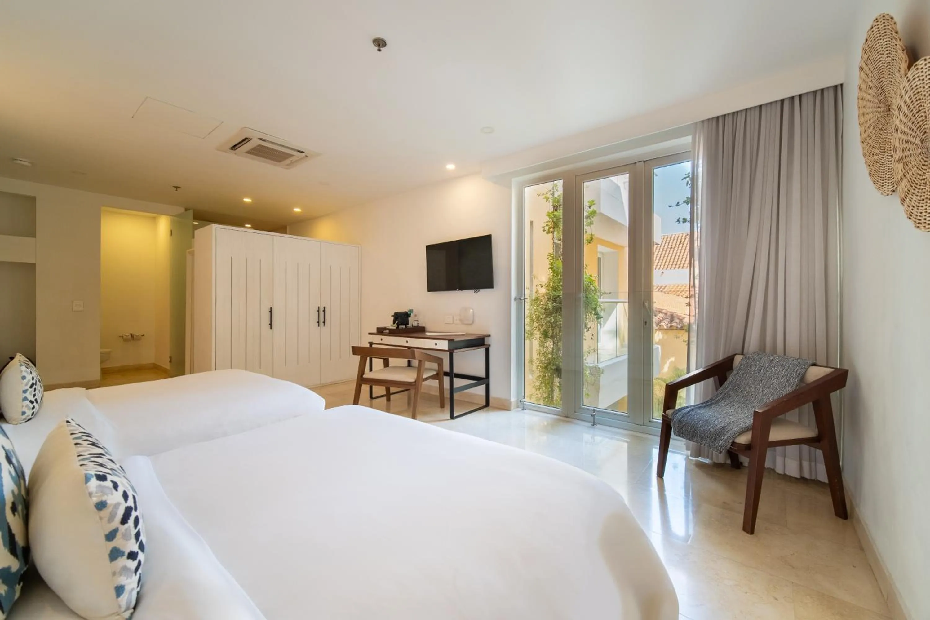 Photo of the whole room, Bed in Nacar Hotel Cartagena, Curio Collection by Hilton