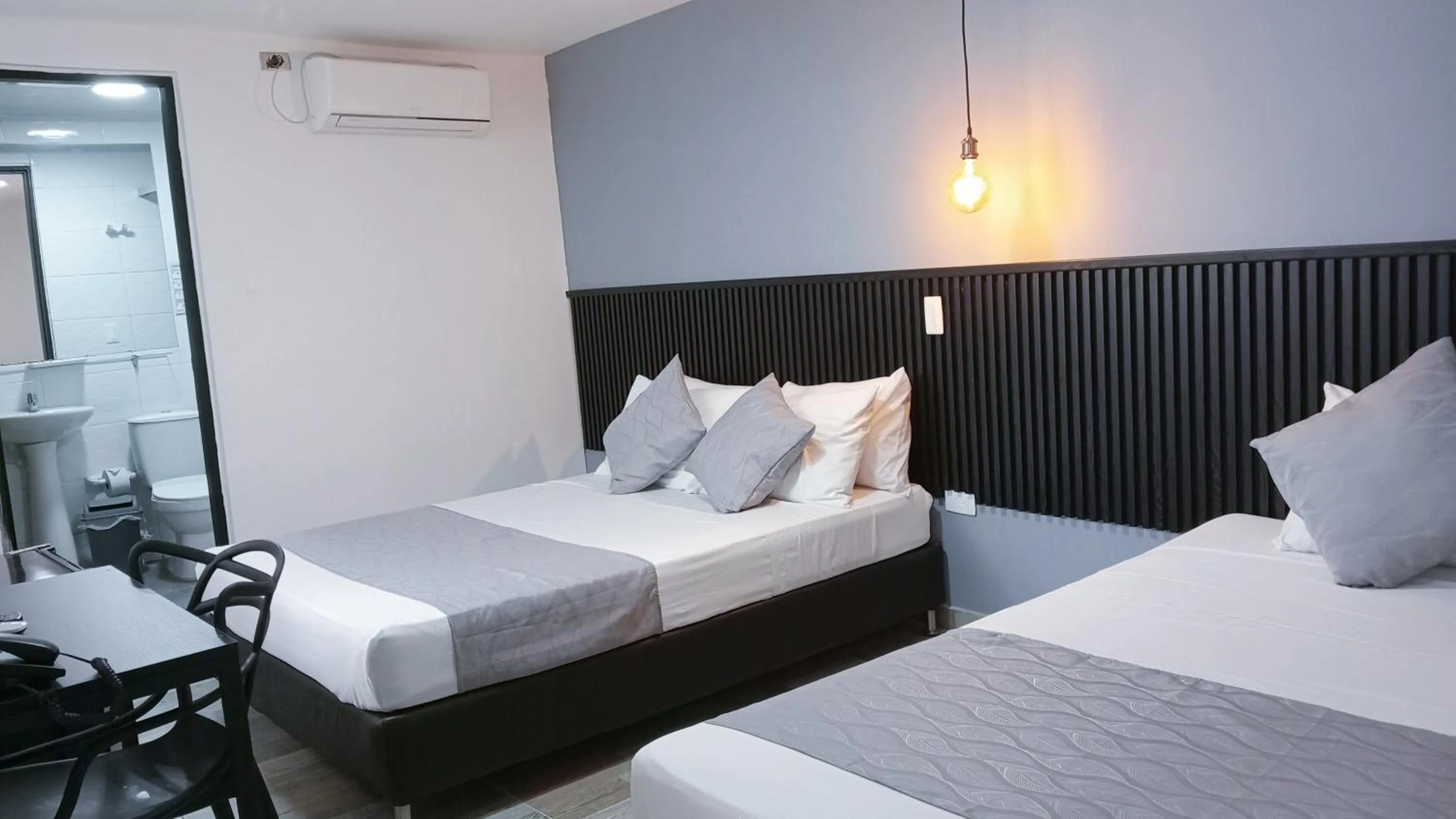 air conditioner, Bed in Hotel Palmas del Estadio