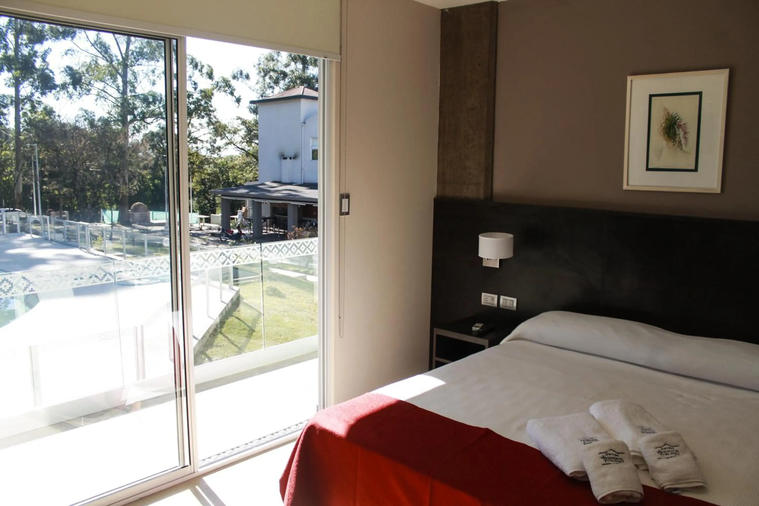 Bed in Hostería Atahualpa Yupanqui