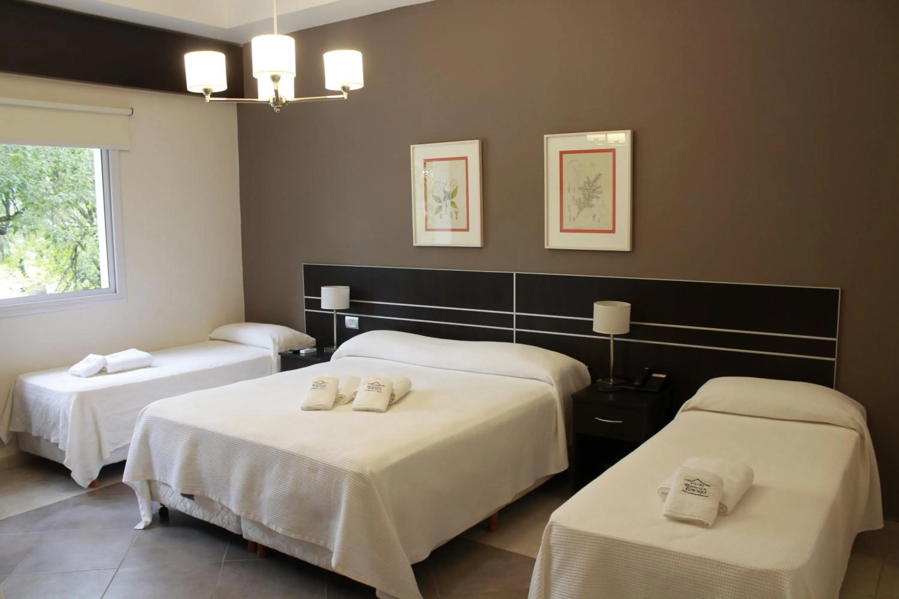 Bed in Hostería Atahualpa Yupanqui