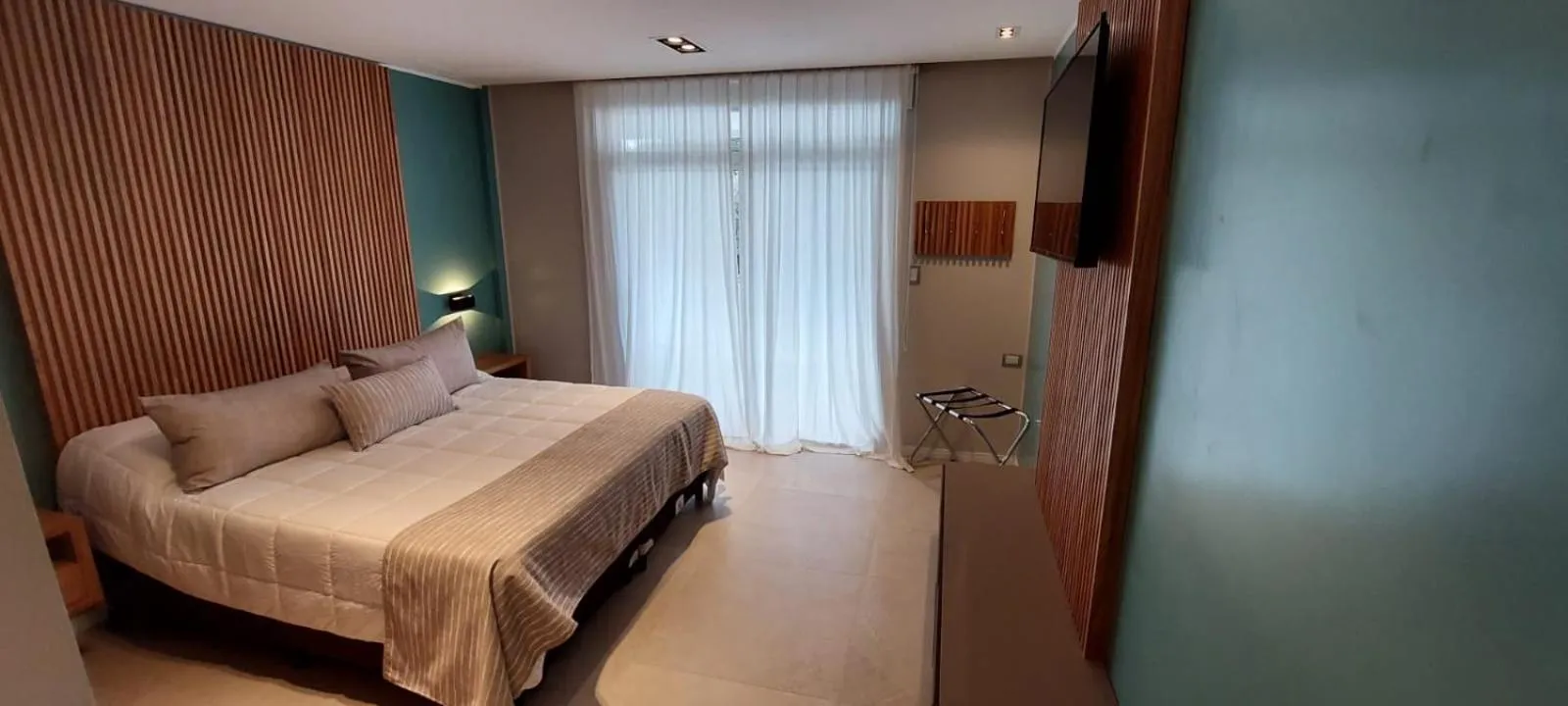 Bed in Hostería Atahualpa Yupanqui