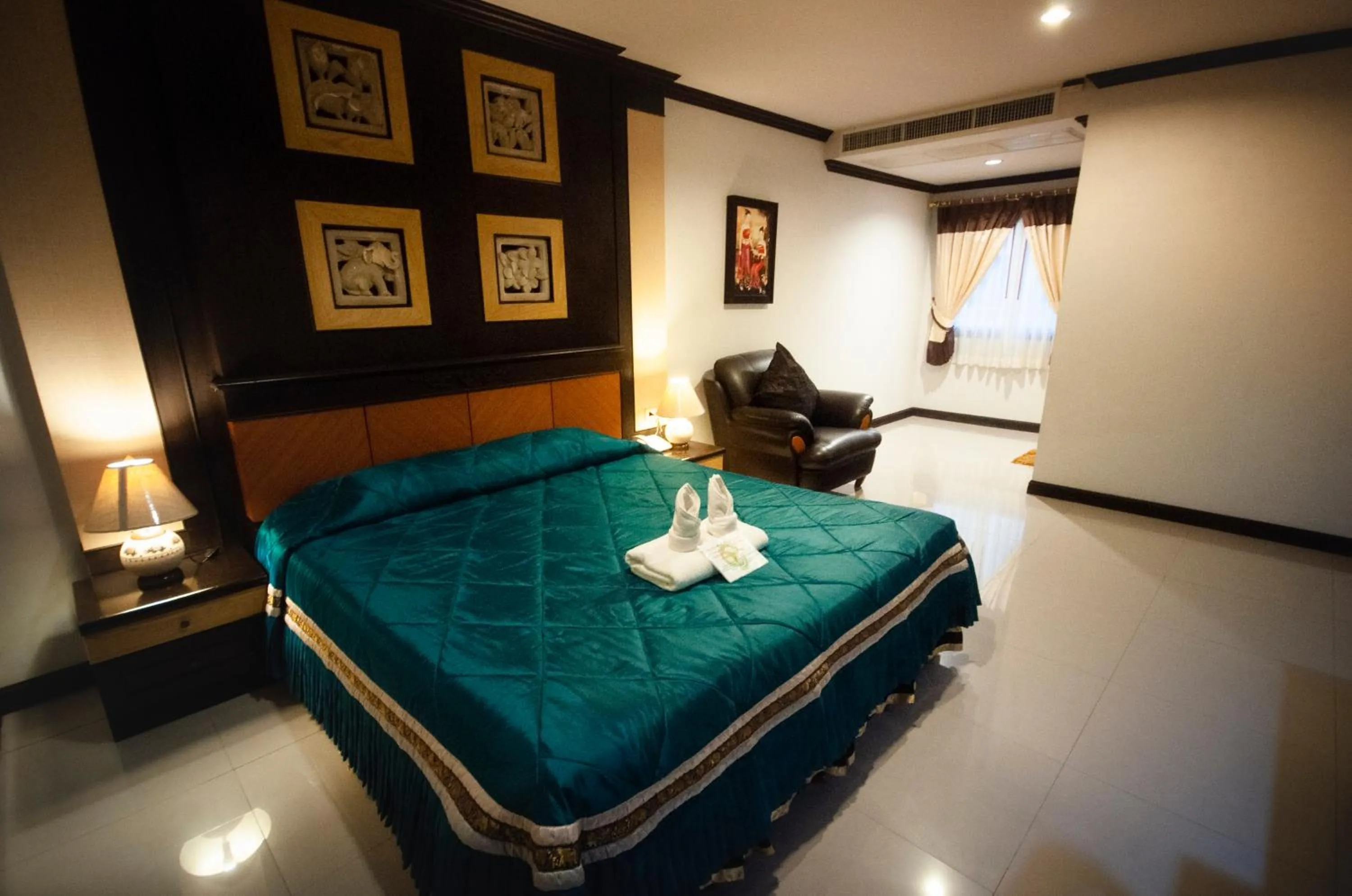 Bed in Chiangrai Grand Room Hotel
