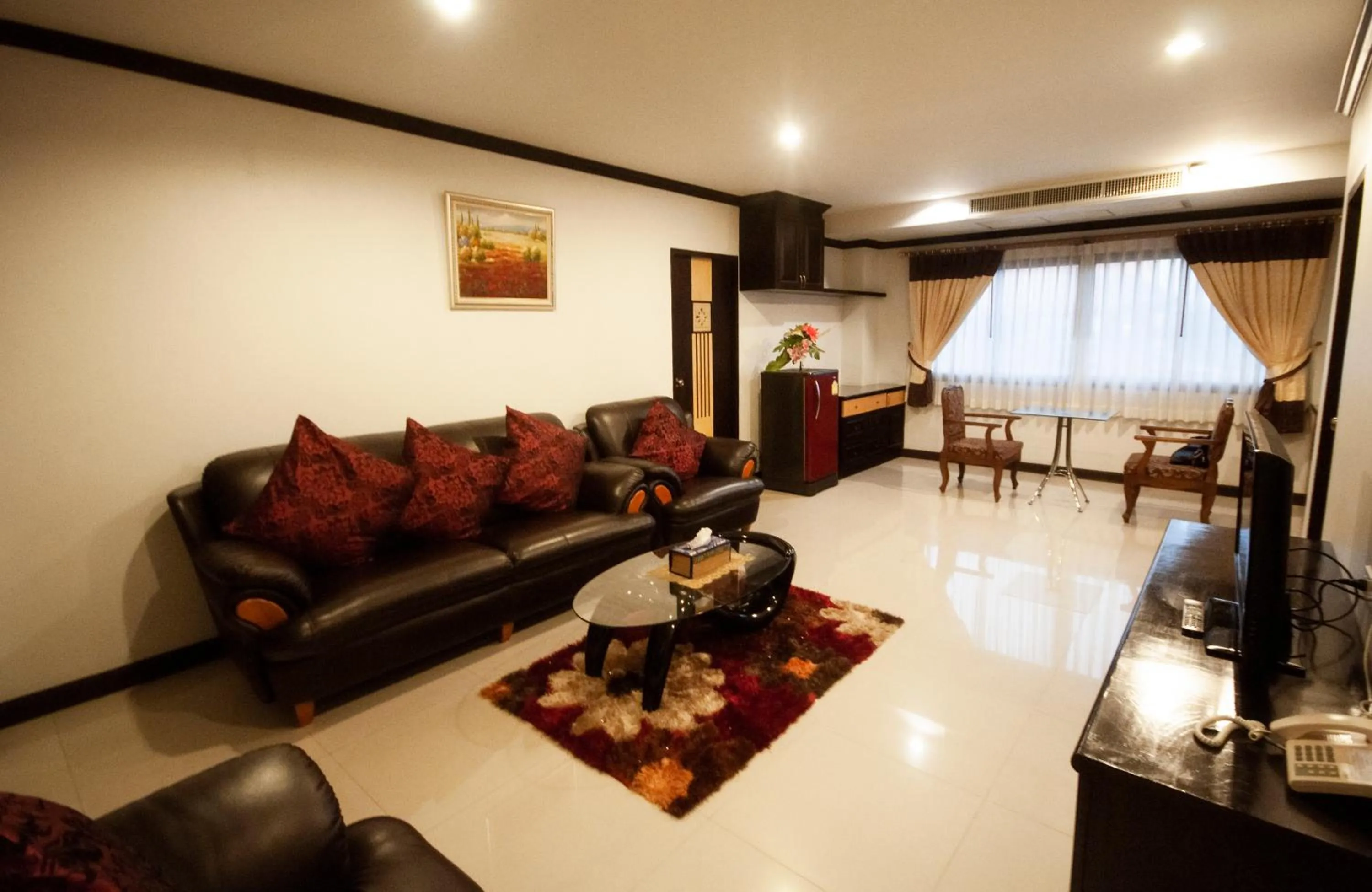 Living room in Chiangrai Grand Room Hotel