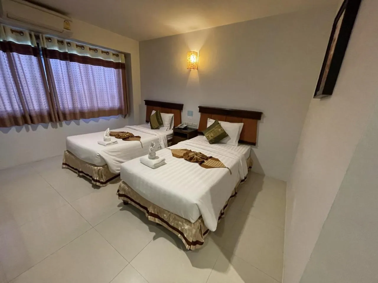 Bed in Chiangrai Grand Room Hotel