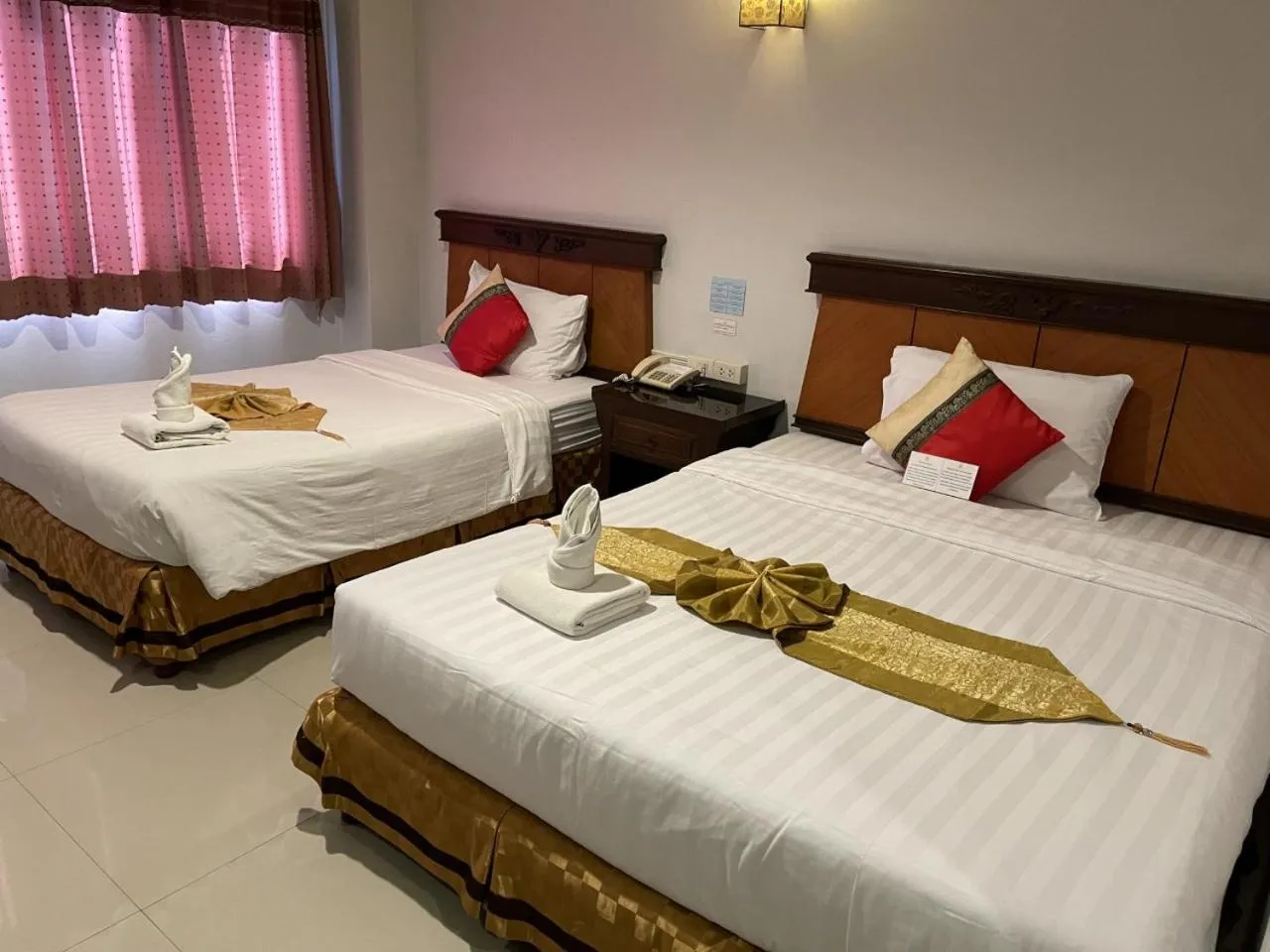 Bed in Chiangrai Grand Room Hotel