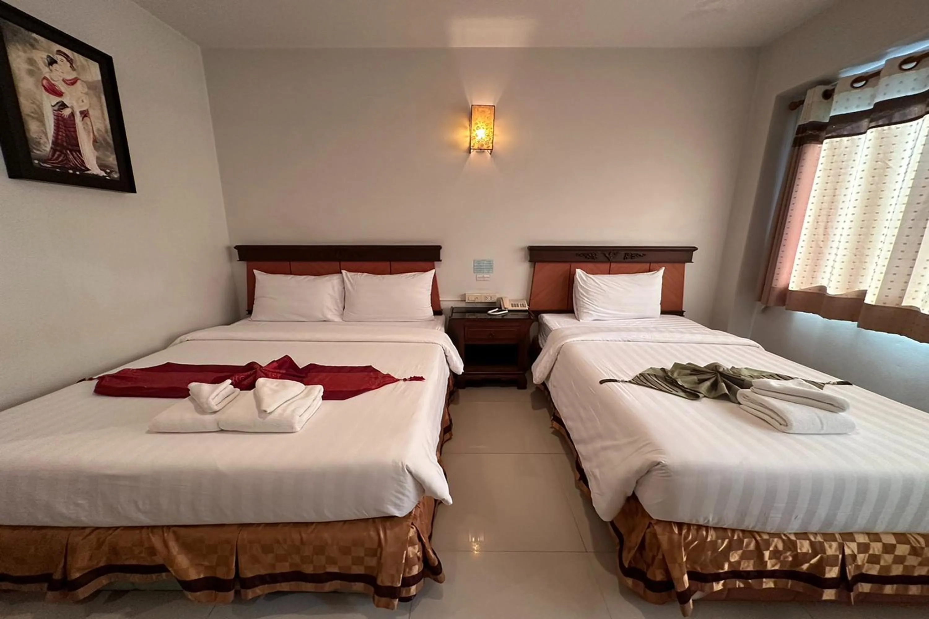 Bed in Chiangrai Grand Room Hotel