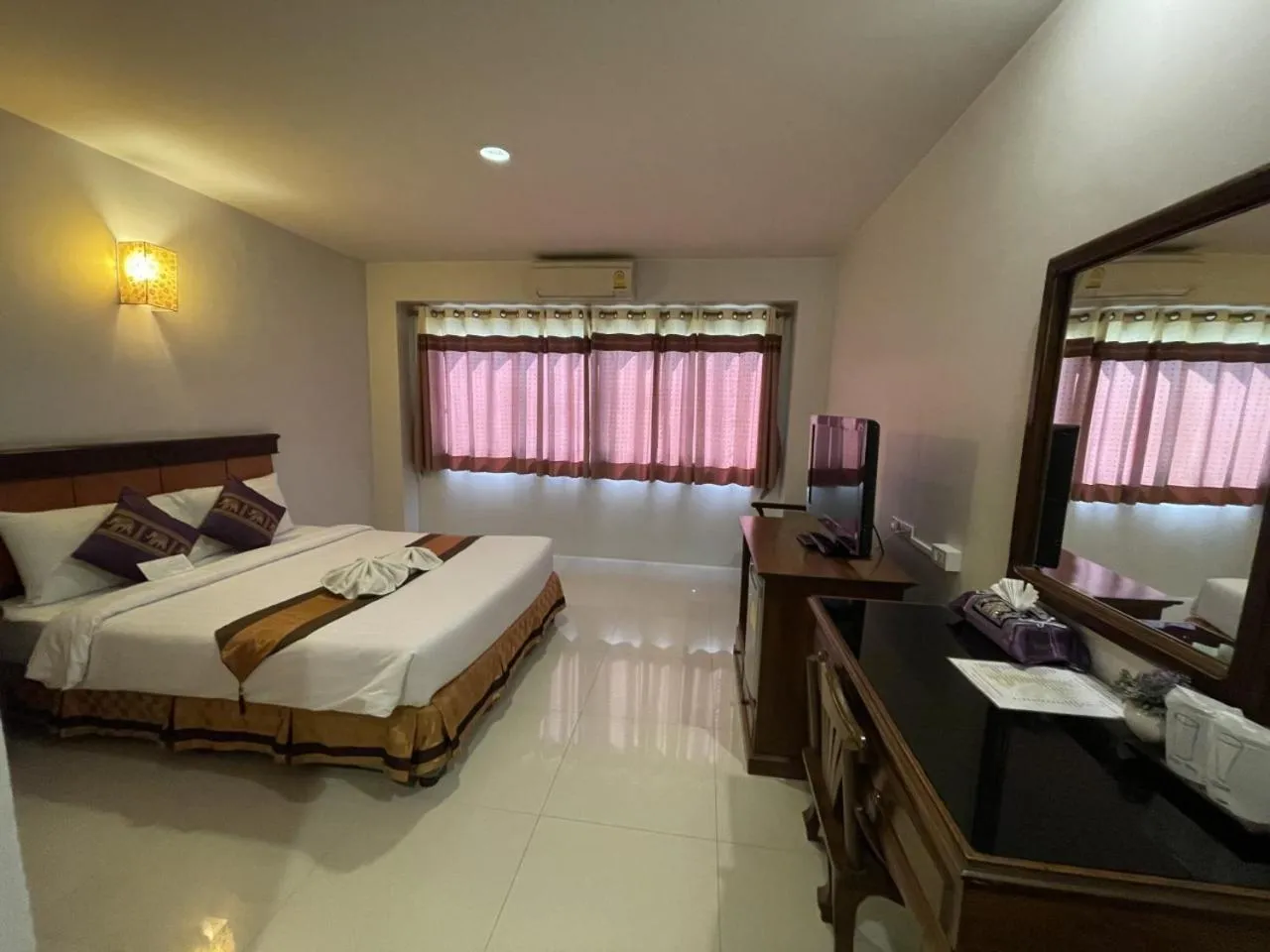 Bed in Chiangrai Grand Room Hotel
