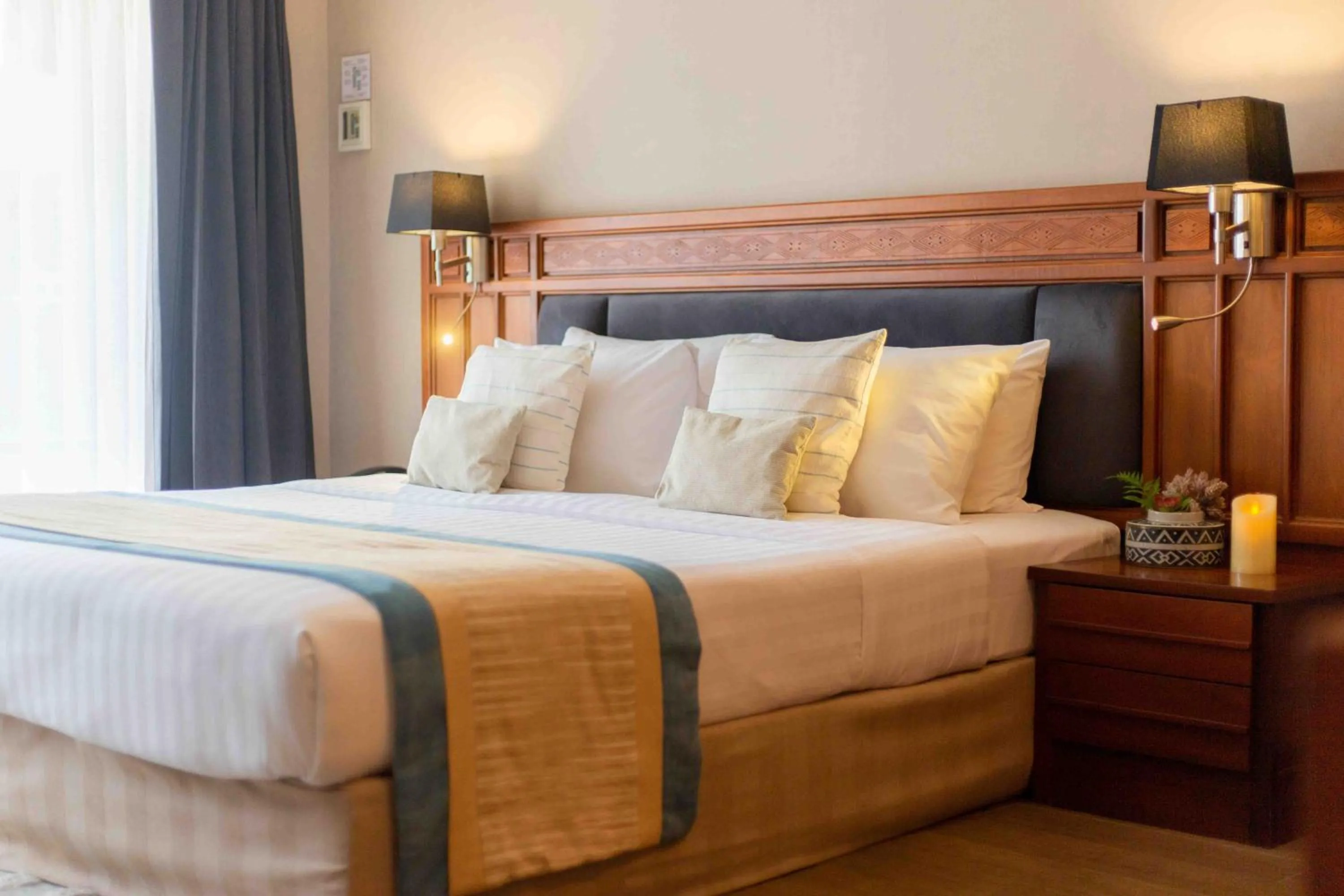 Bed in Tohsang Heritage Ubon Hotel