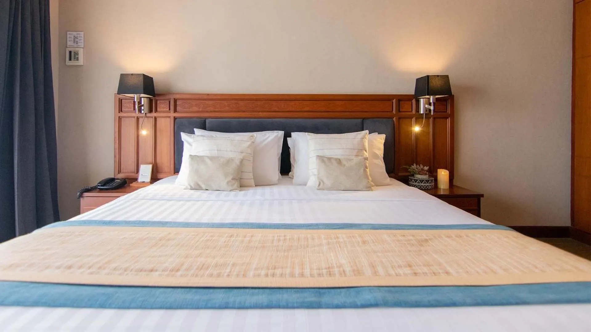 Bed in Tohsang Heritage Ubon Hotel