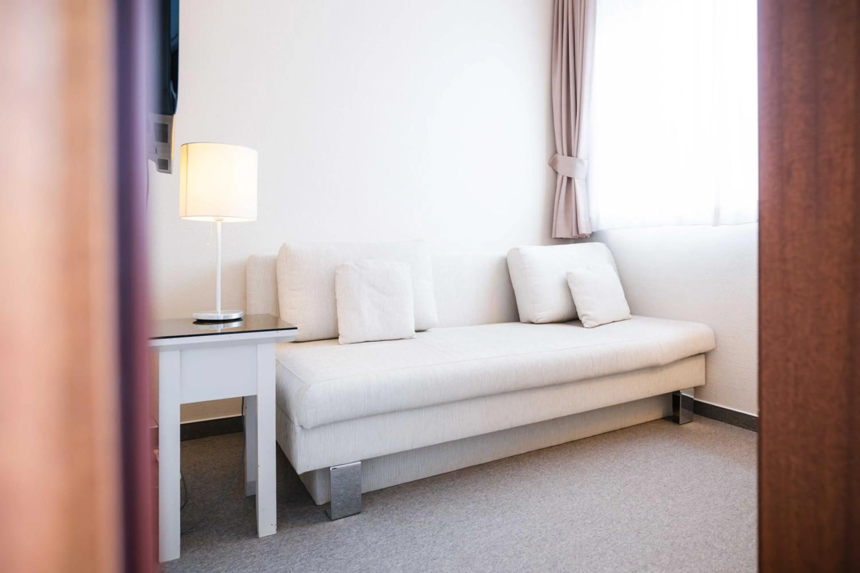 Photo of the whole room, Bed in Hotel des Nordens Flensburg Wellness & Spa