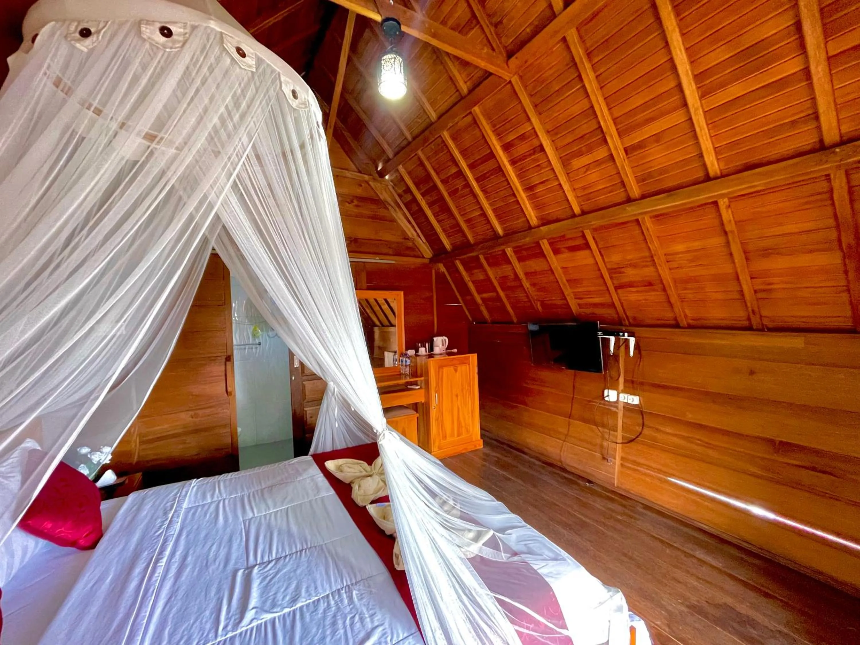 Bed in Ayu Laba Beach Villa and Resto