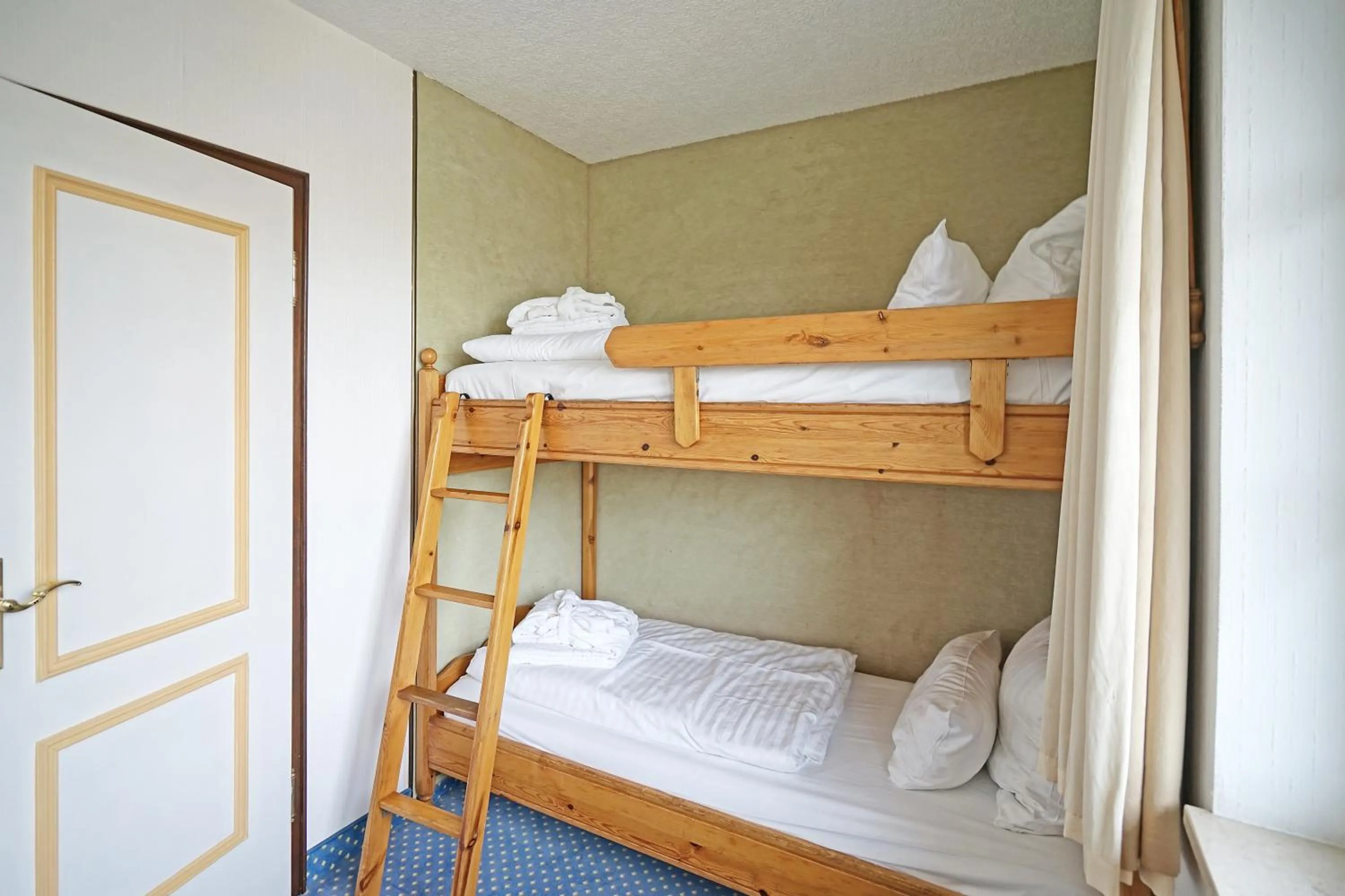 Bedroom, Bed in Hotel Appartement Landhaus Stutzi - Hotel Strandperle