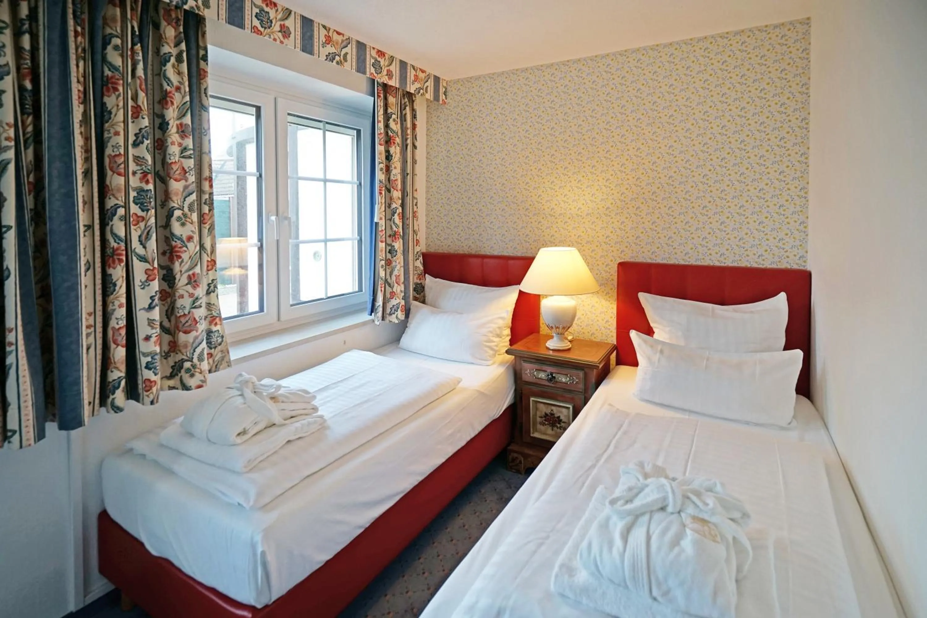 Bedroom, Bed in Hotel Appartement Landhaus Stutzi - Hotel Strandperle