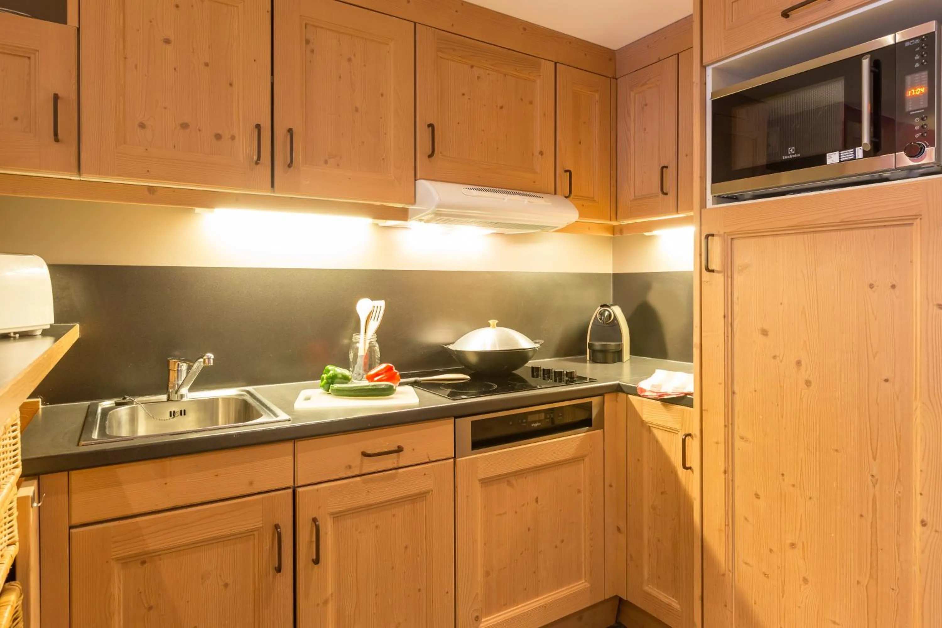 Kitchen or kitchenette in Résidence Pierre & Vacances Premium les Crets