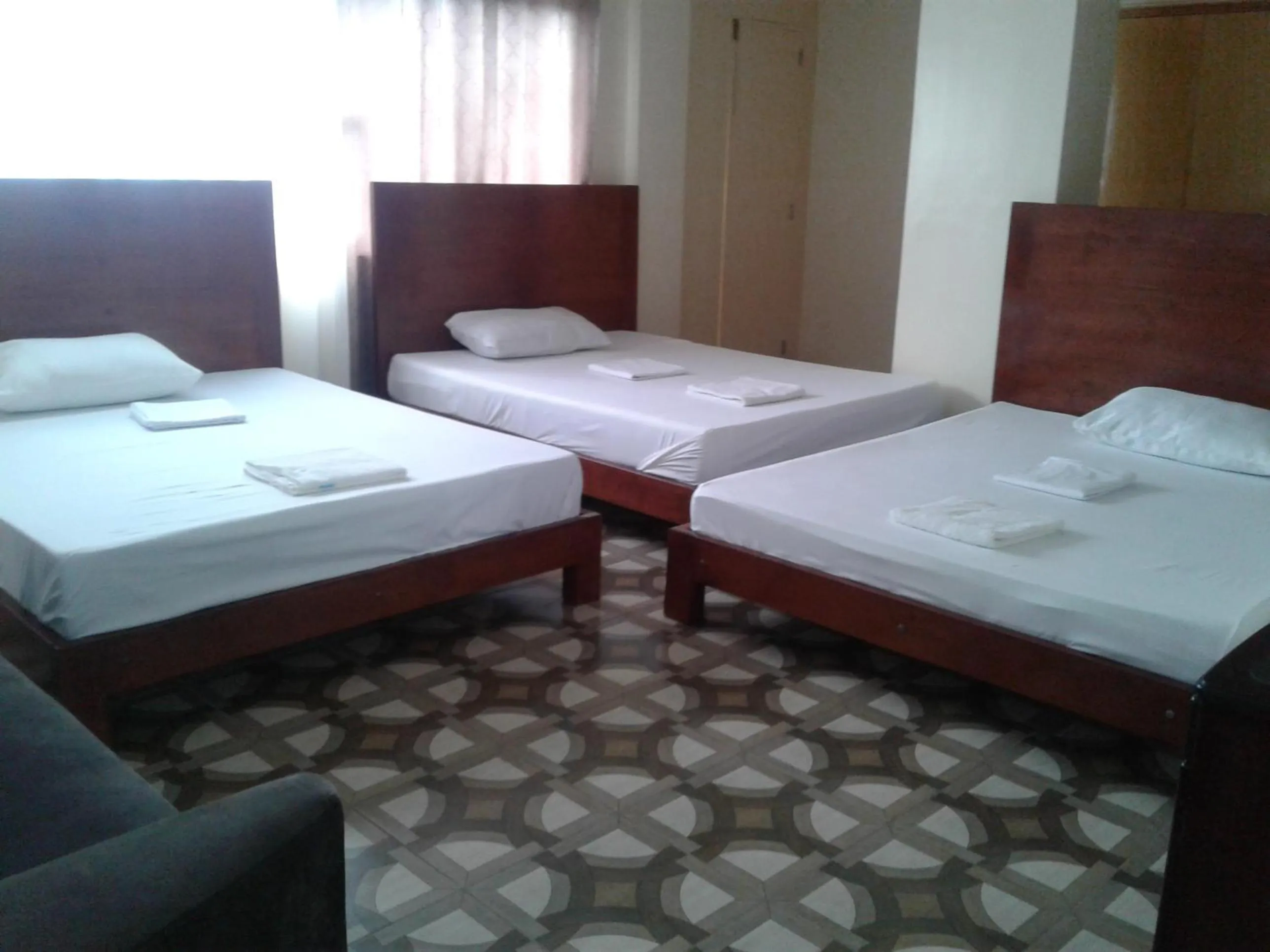Bed in WMV Hotel & Restaurant