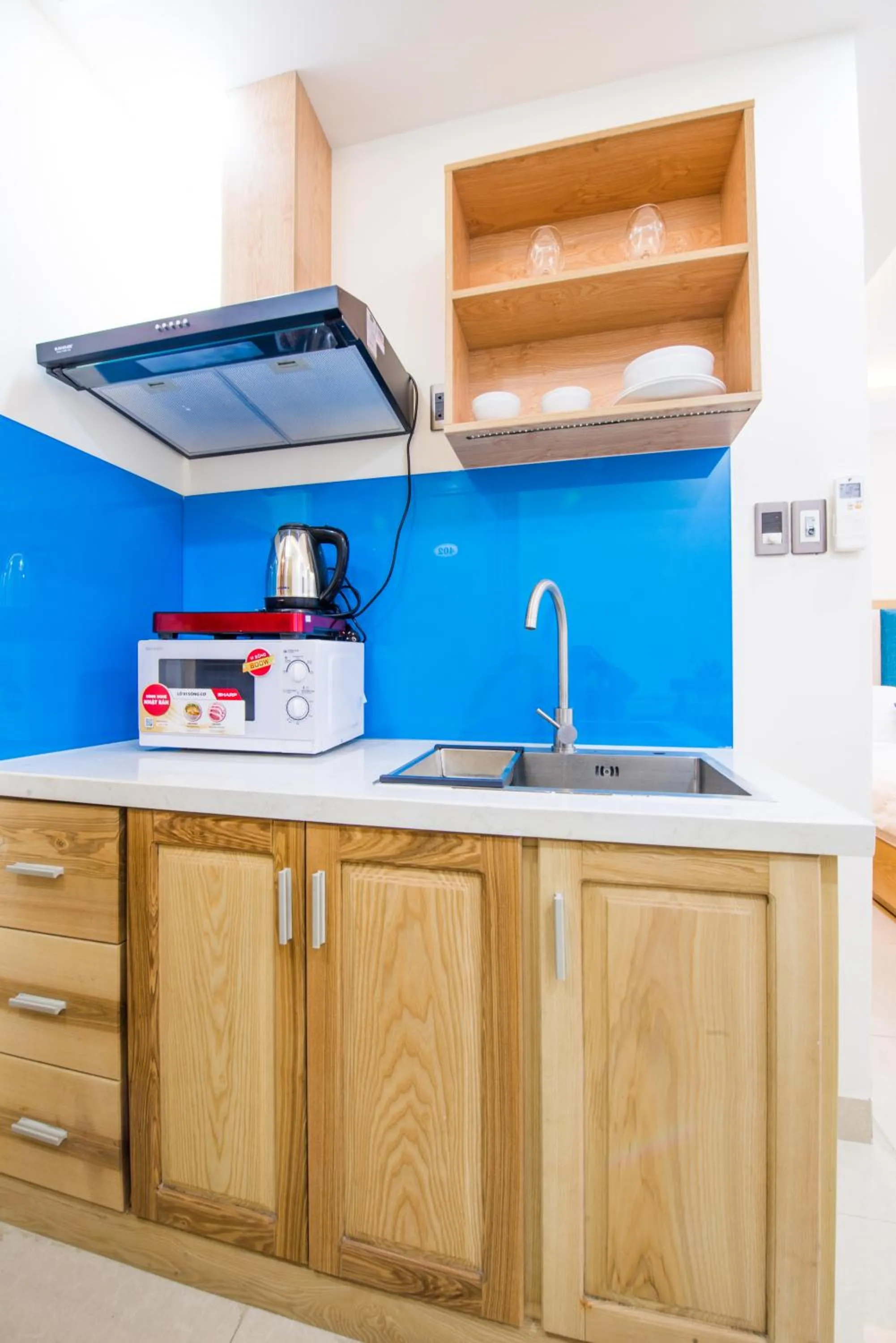 Communal kitchen in Sincero Hotel & Apartment