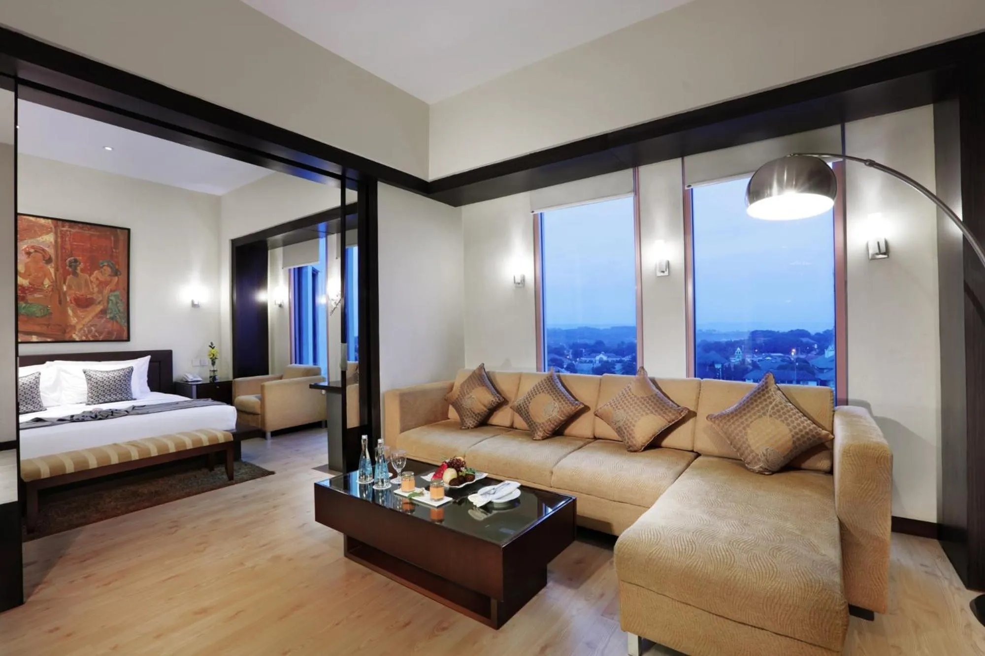 Living room, Bed in Grand Candi Hotel