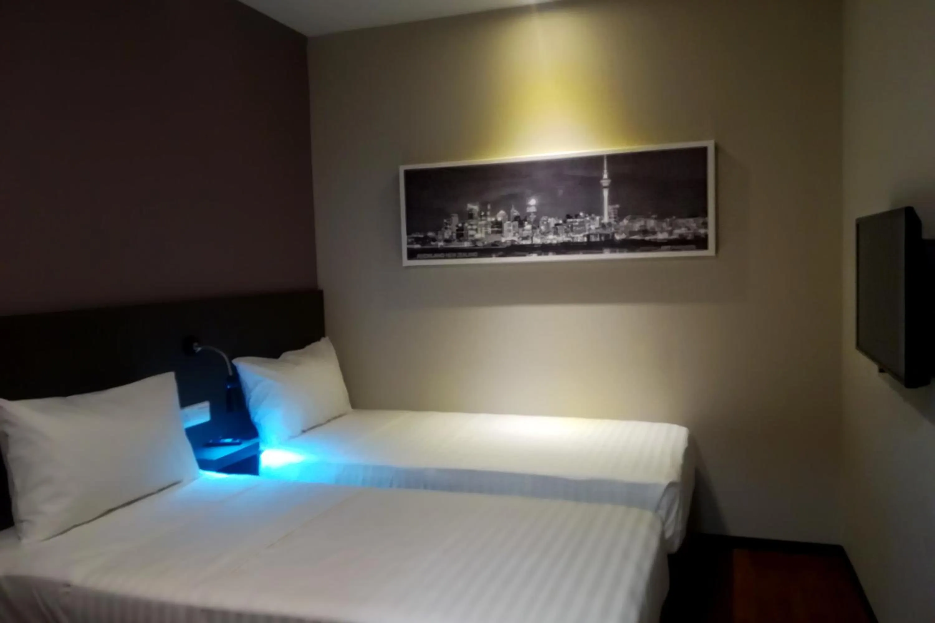 Bed in The Loft Plaza Hotel