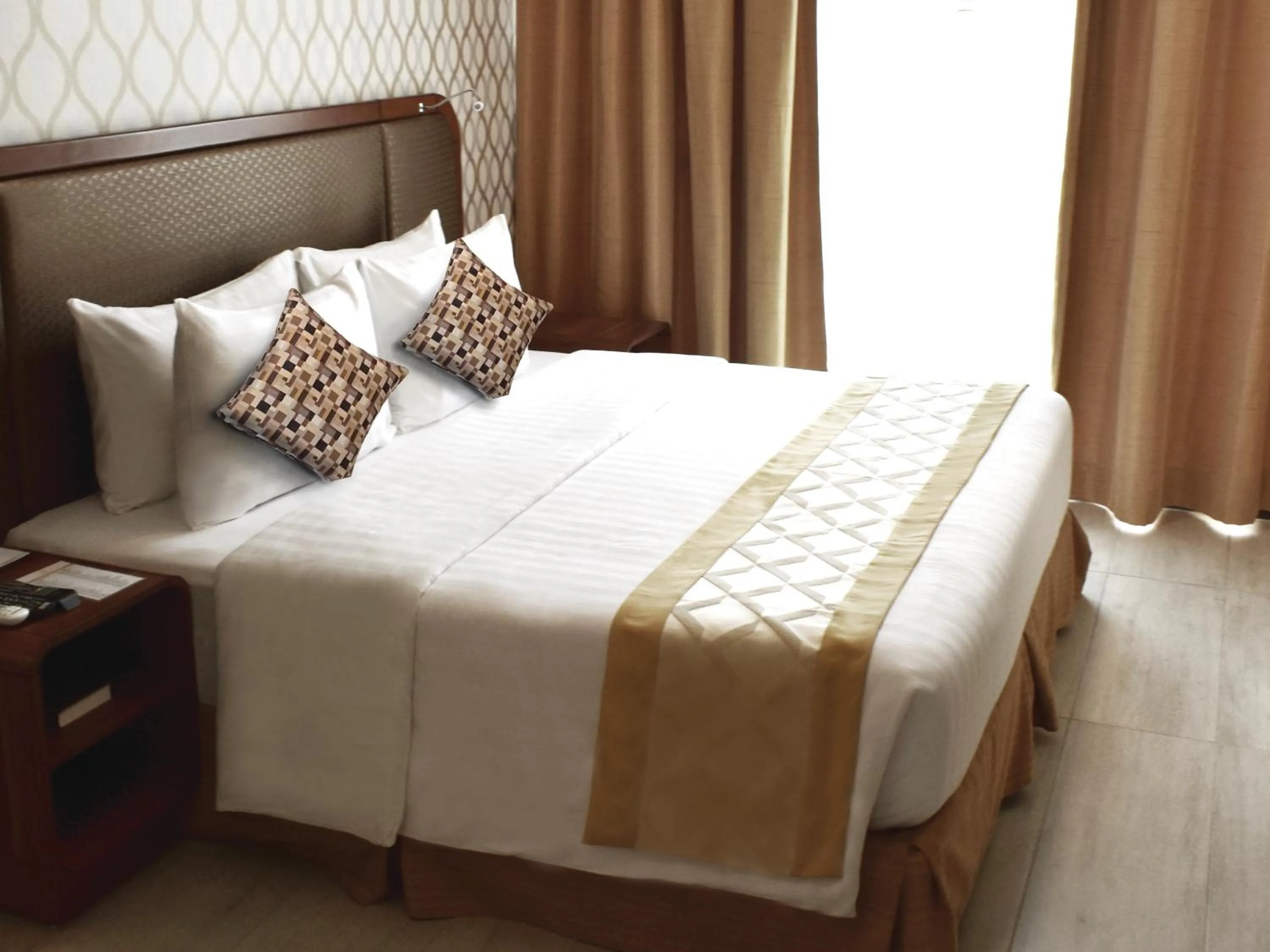 Bedroom, Bed in One Central Hotel & Suites