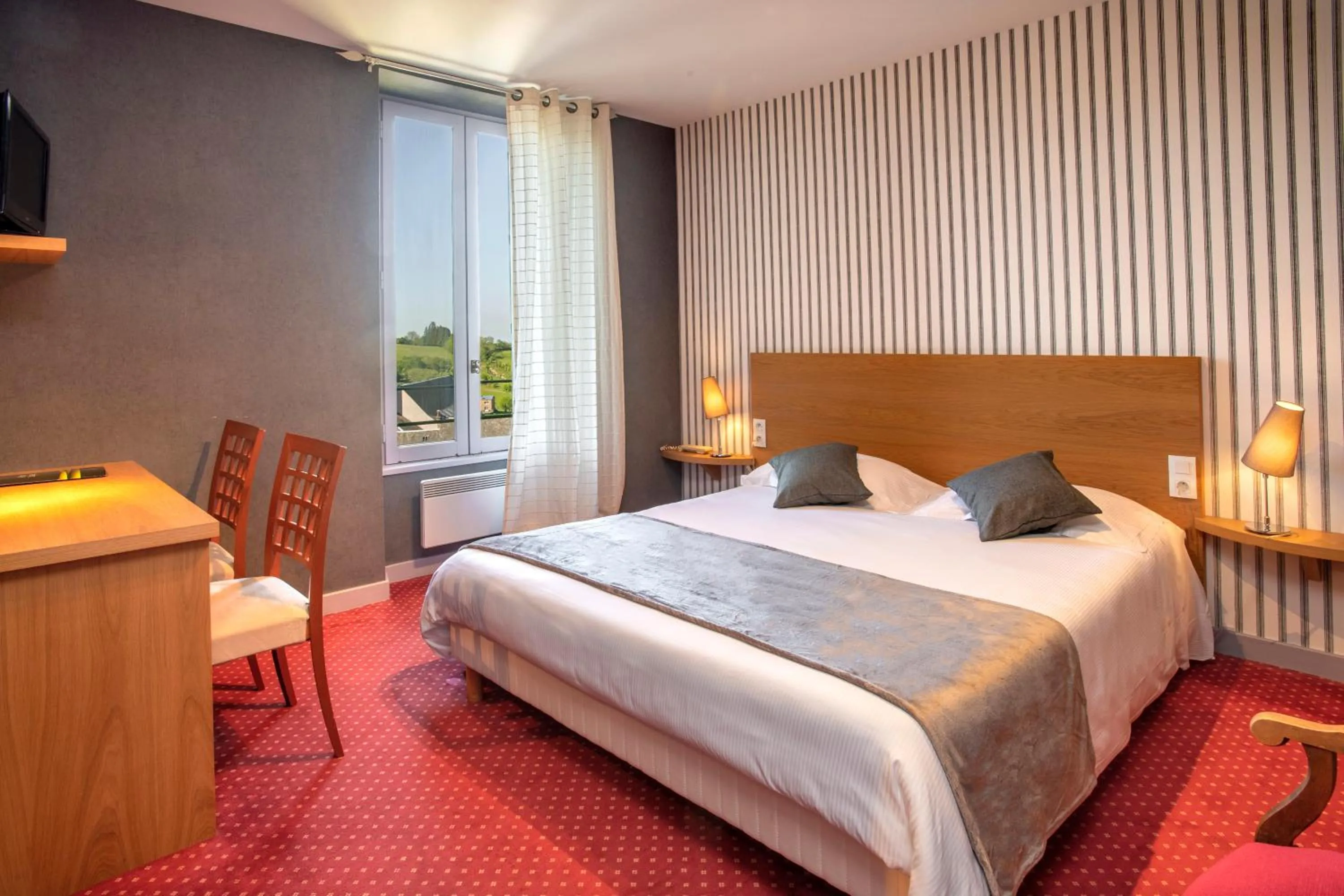 Photo of the whole room, Bed in Logis Hôtel Restaurant Gilles Moreau Laguiole