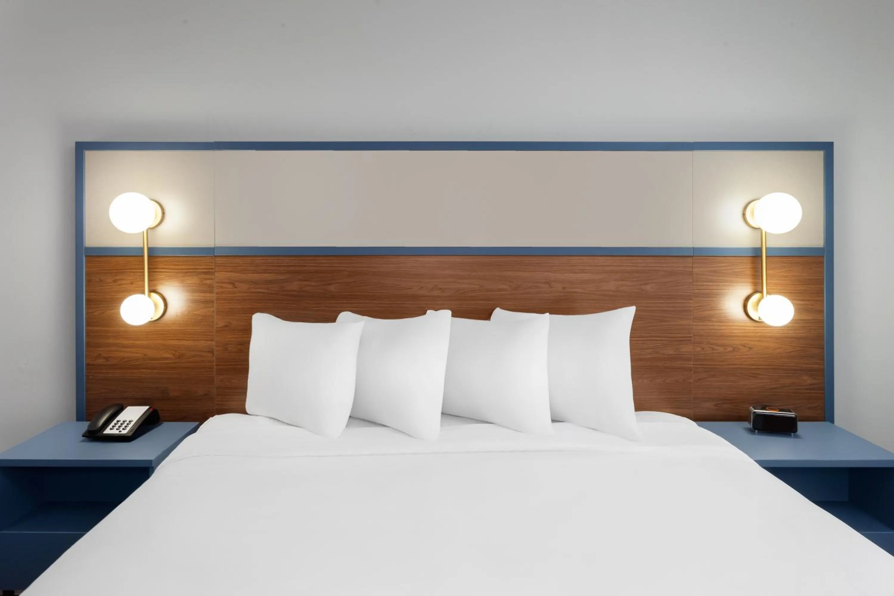 Bed in AmericInn by Wyndham Eagle River Downtown