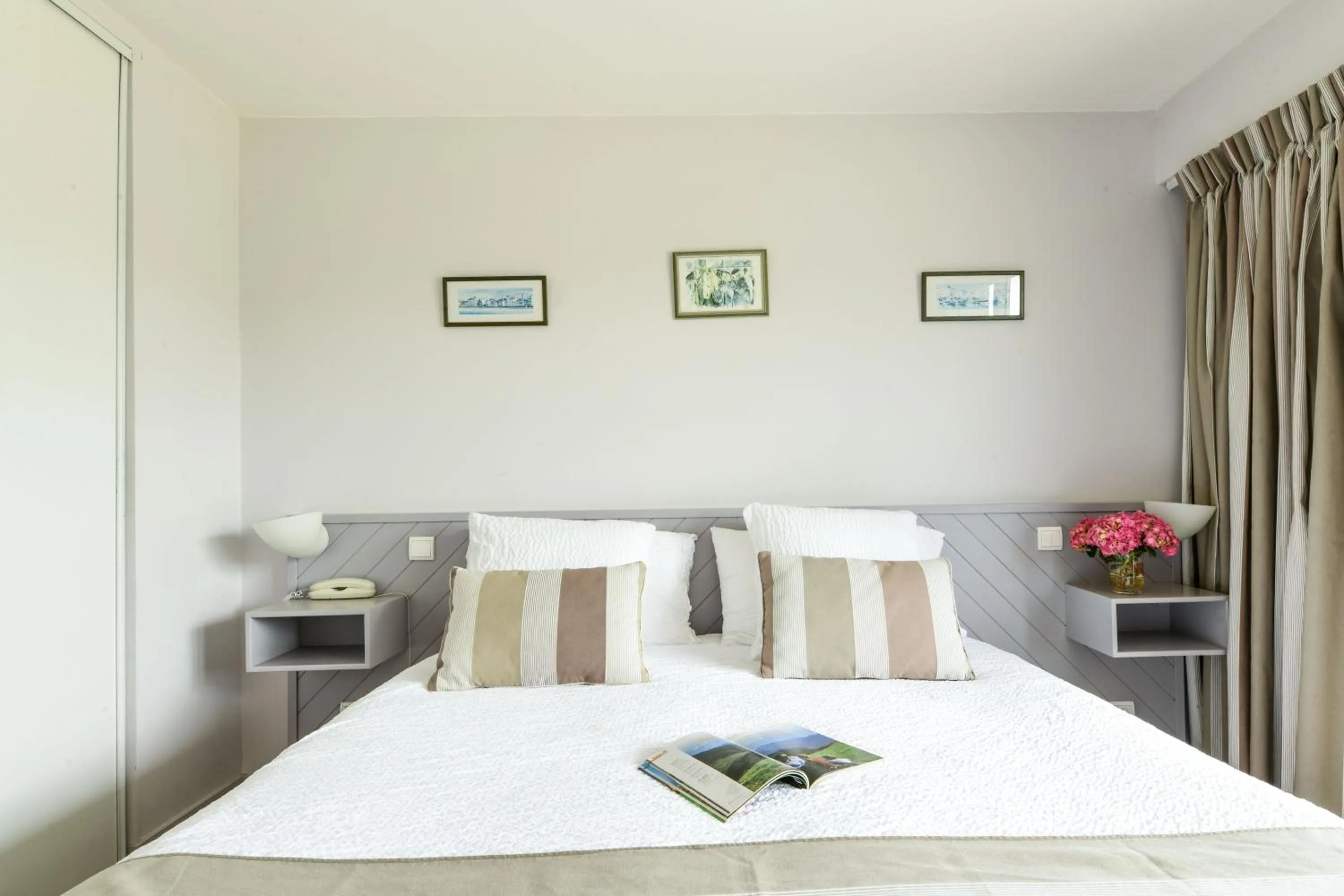 Bed in Logis Hôtel Baratxartea