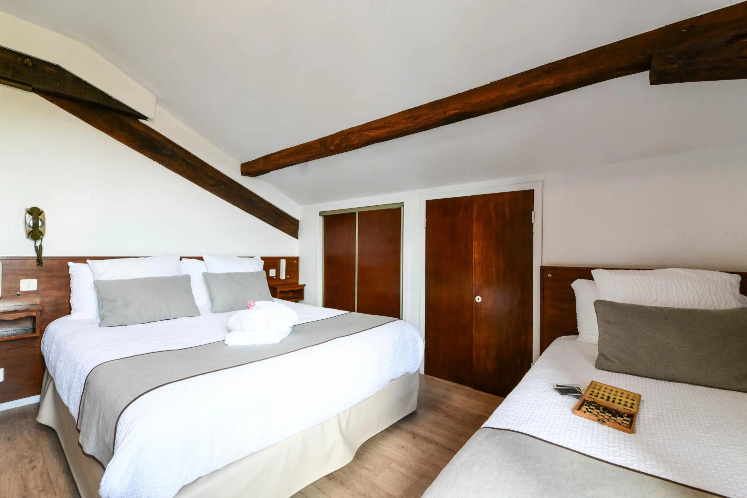 Bed in Logis Hôtel Baratxartea