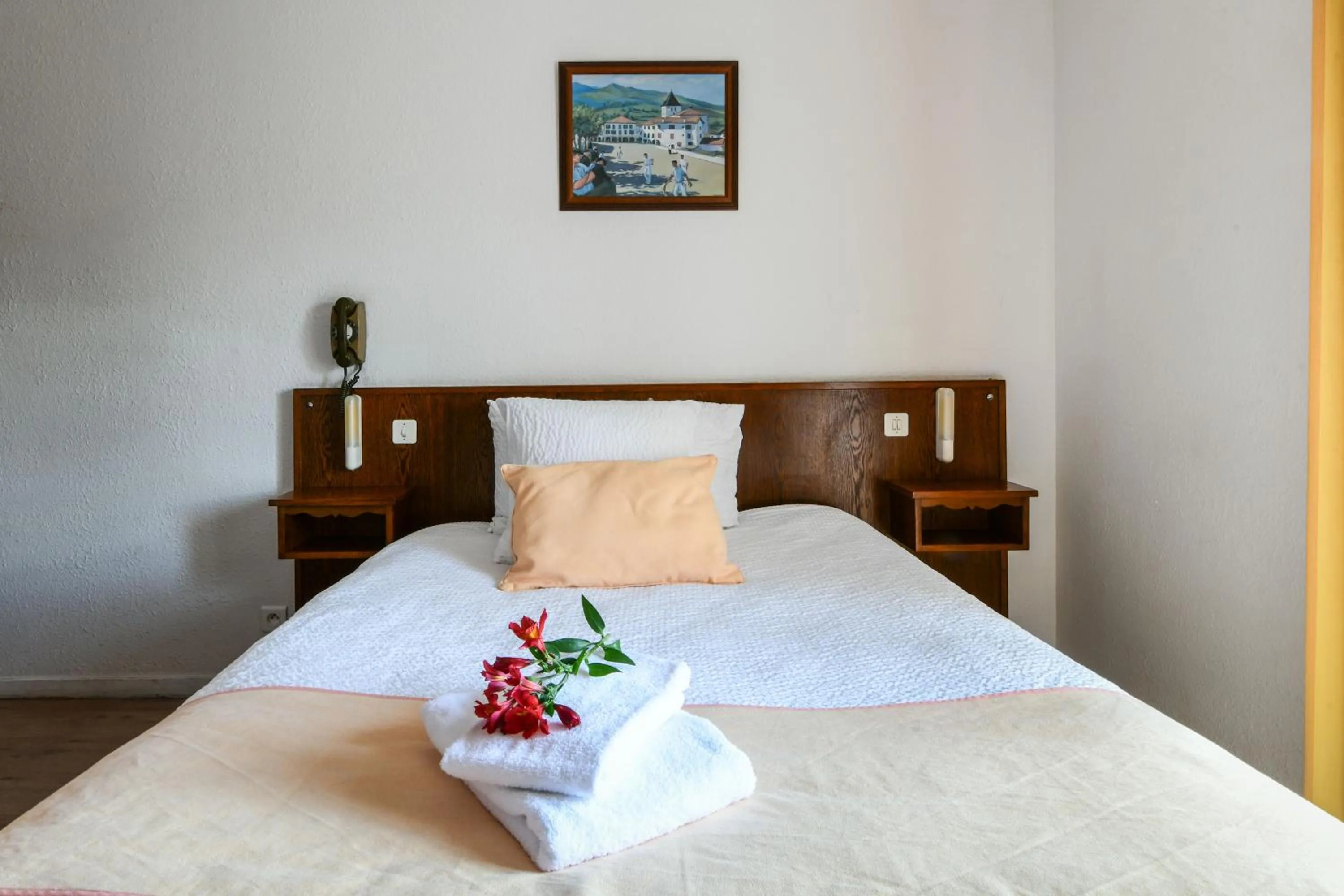 Bed in Logis Hôtel Baratxartea
