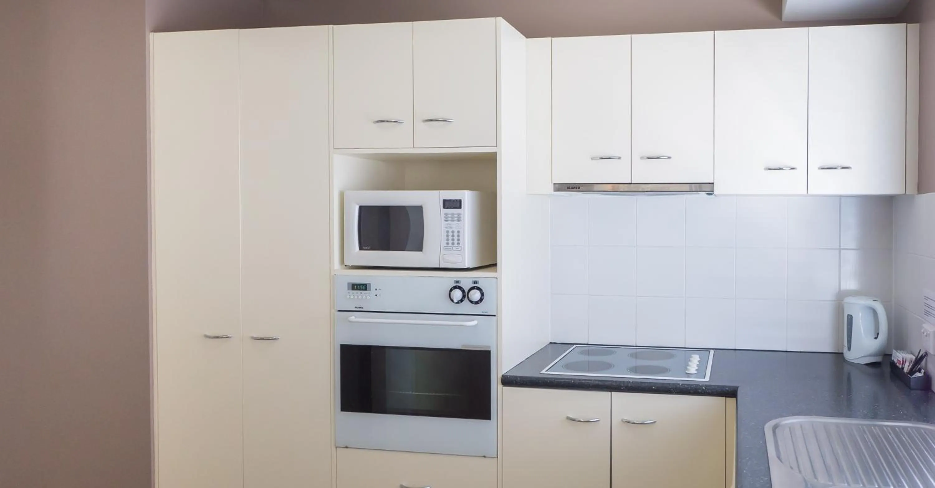 Kitchen or kitchenette in Founda Gardens Apartments