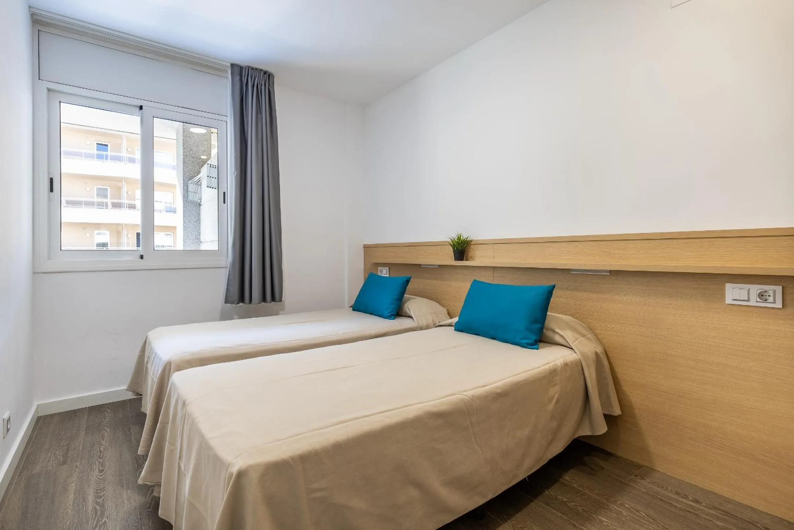 Bed in Rentalmar Zahara family suites