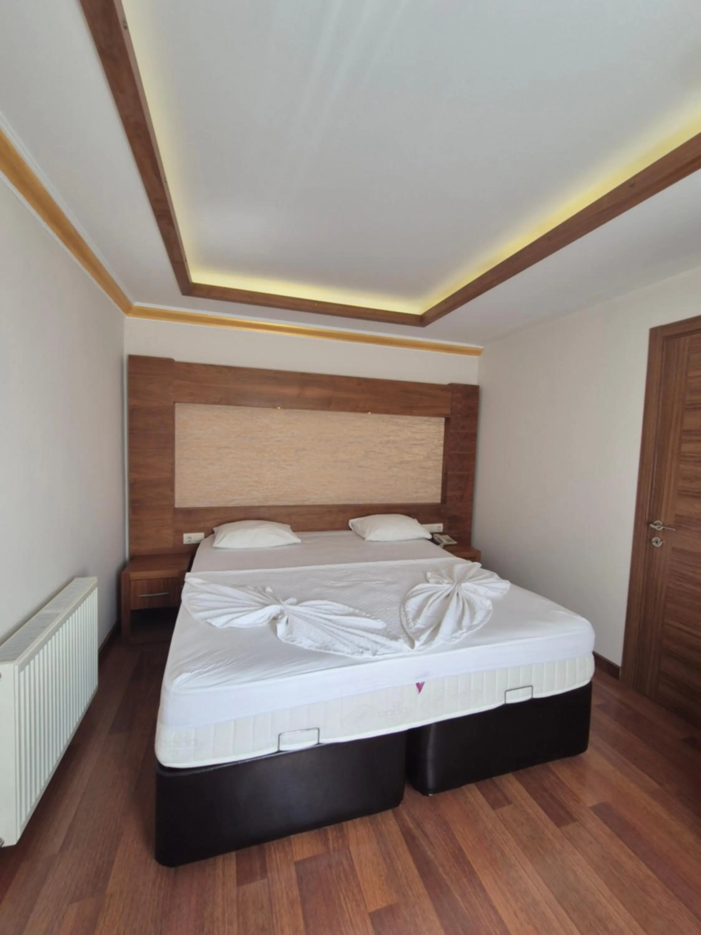 Bed in Dinara Apart Hotel