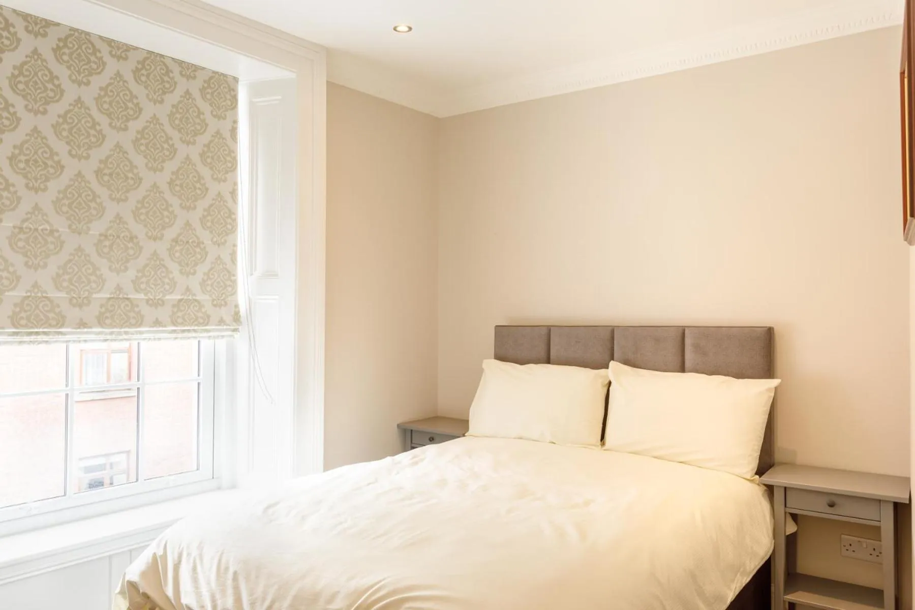 Bed in Molloys Apartments