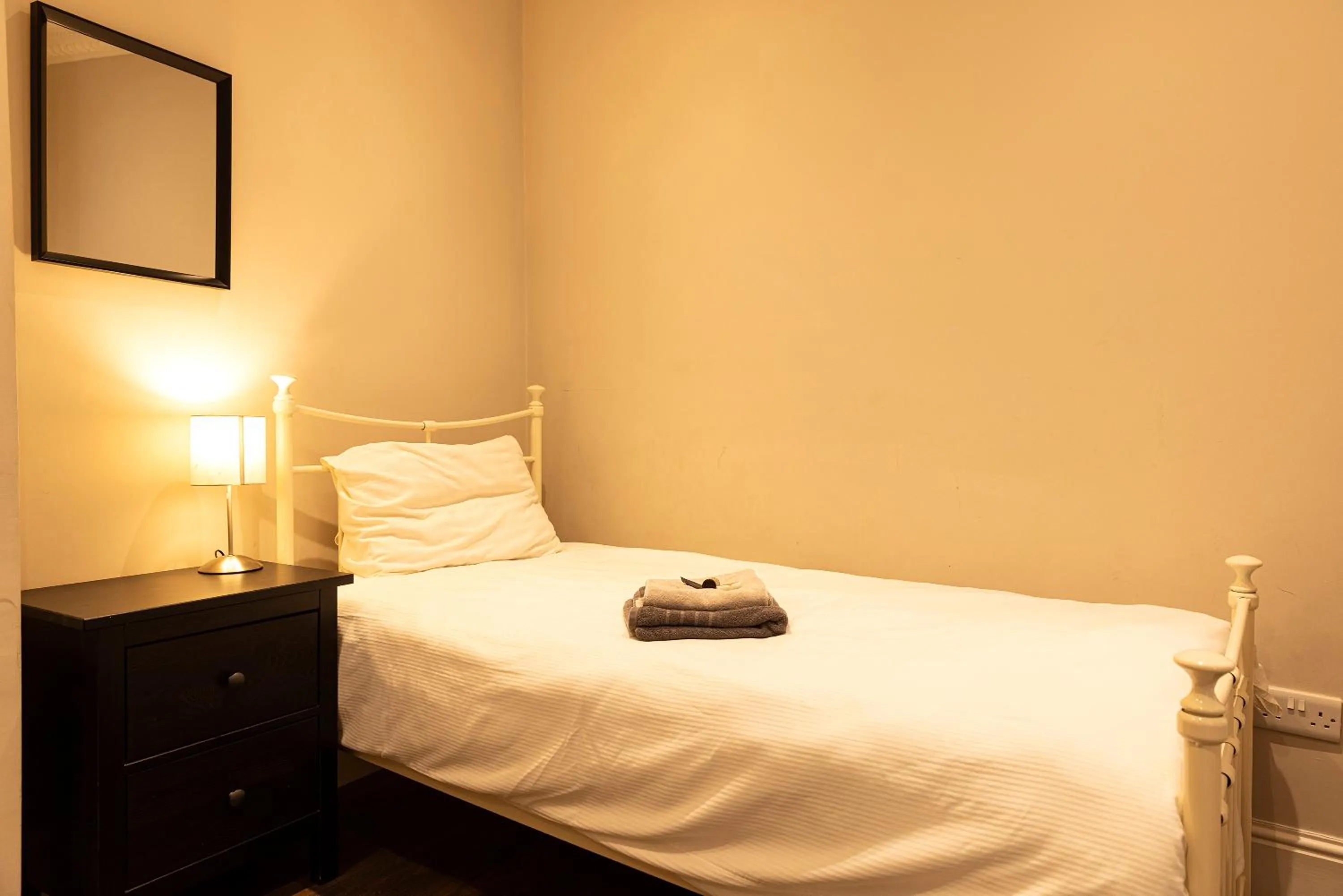 Bed in Molloys Apartments