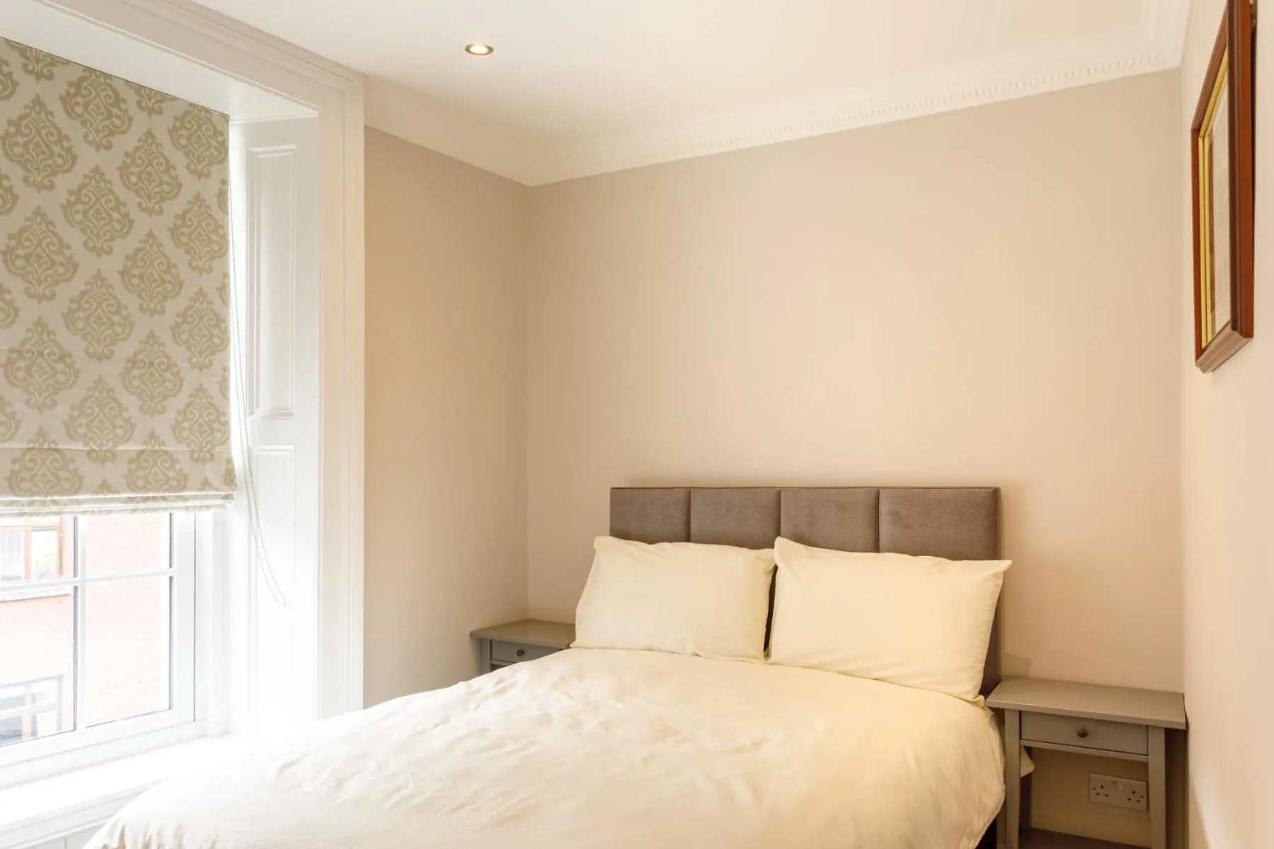 Bed in Molloys Apartments