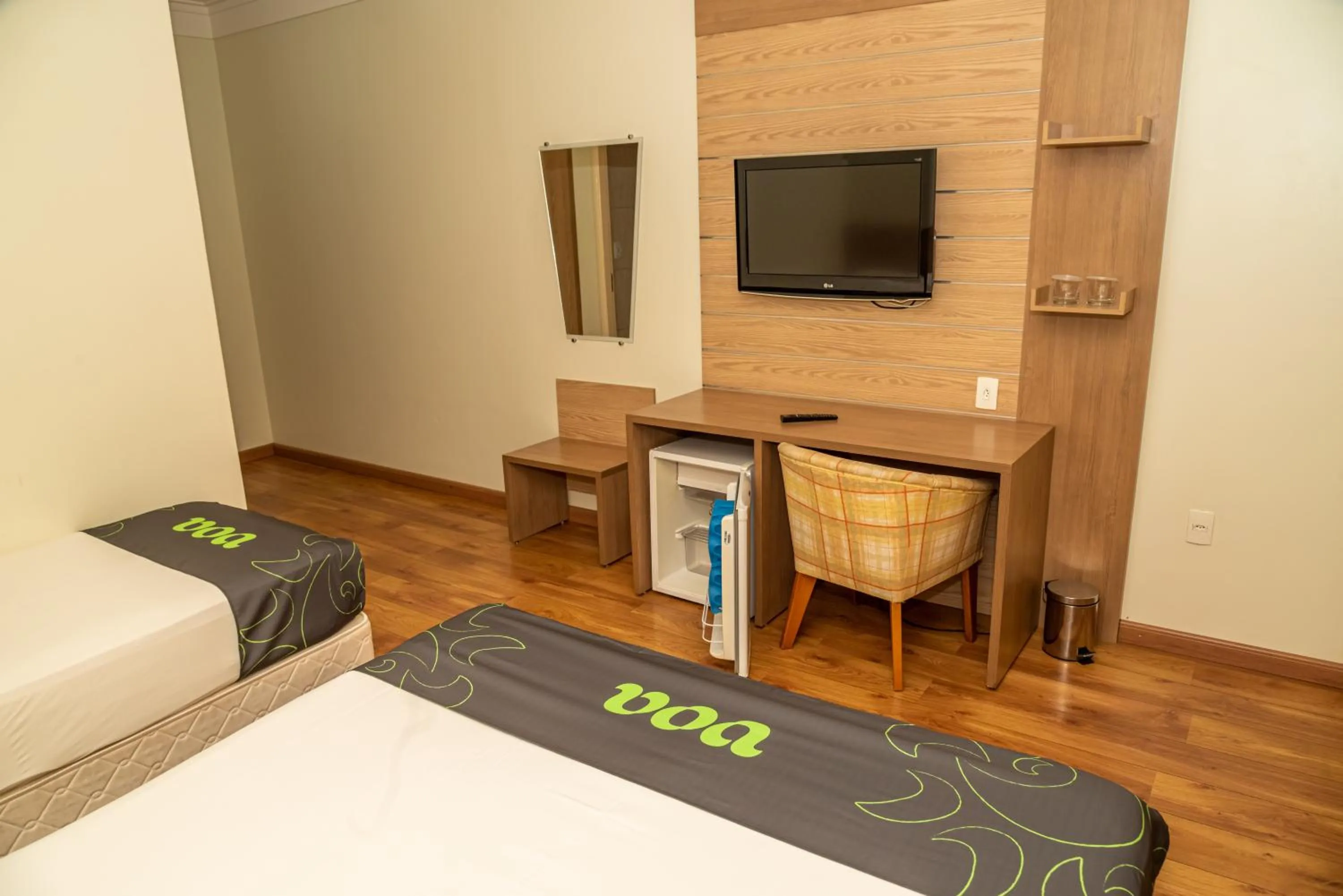 Communal lounge/ TV room, Bed in VOA Hotel Caxambu