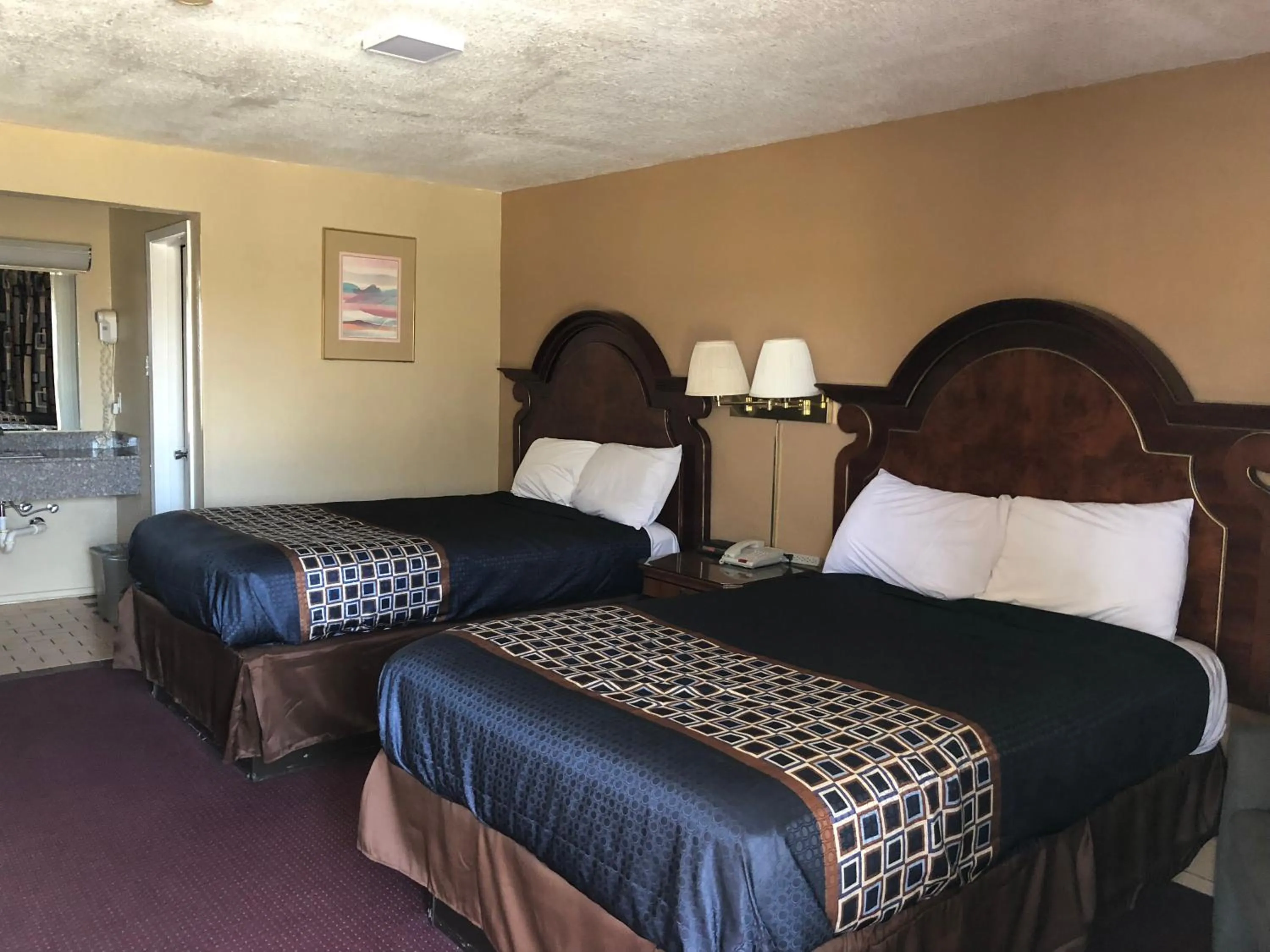 Bed in Villa West Inn