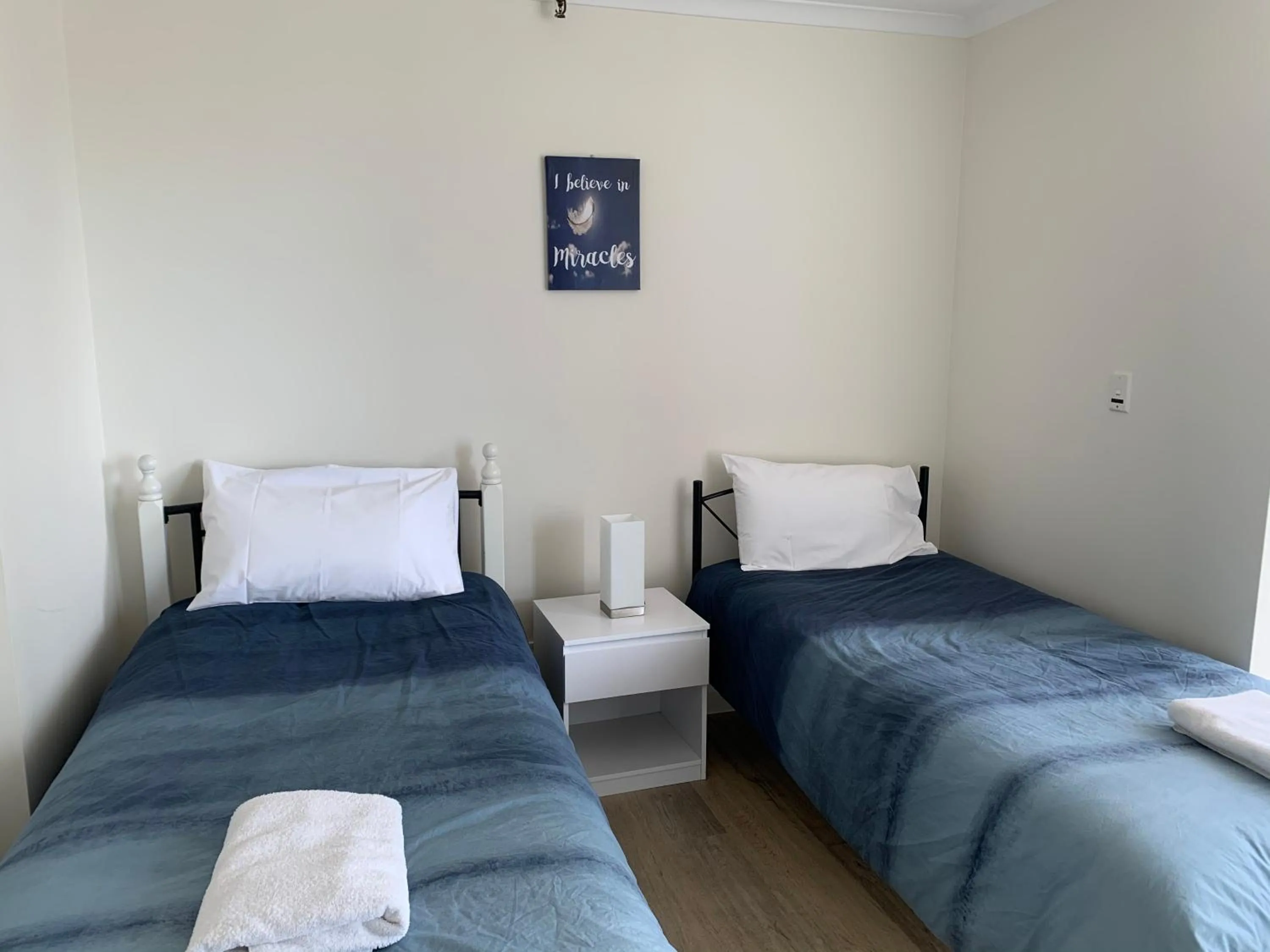 Bed in The Penthouses Apartments