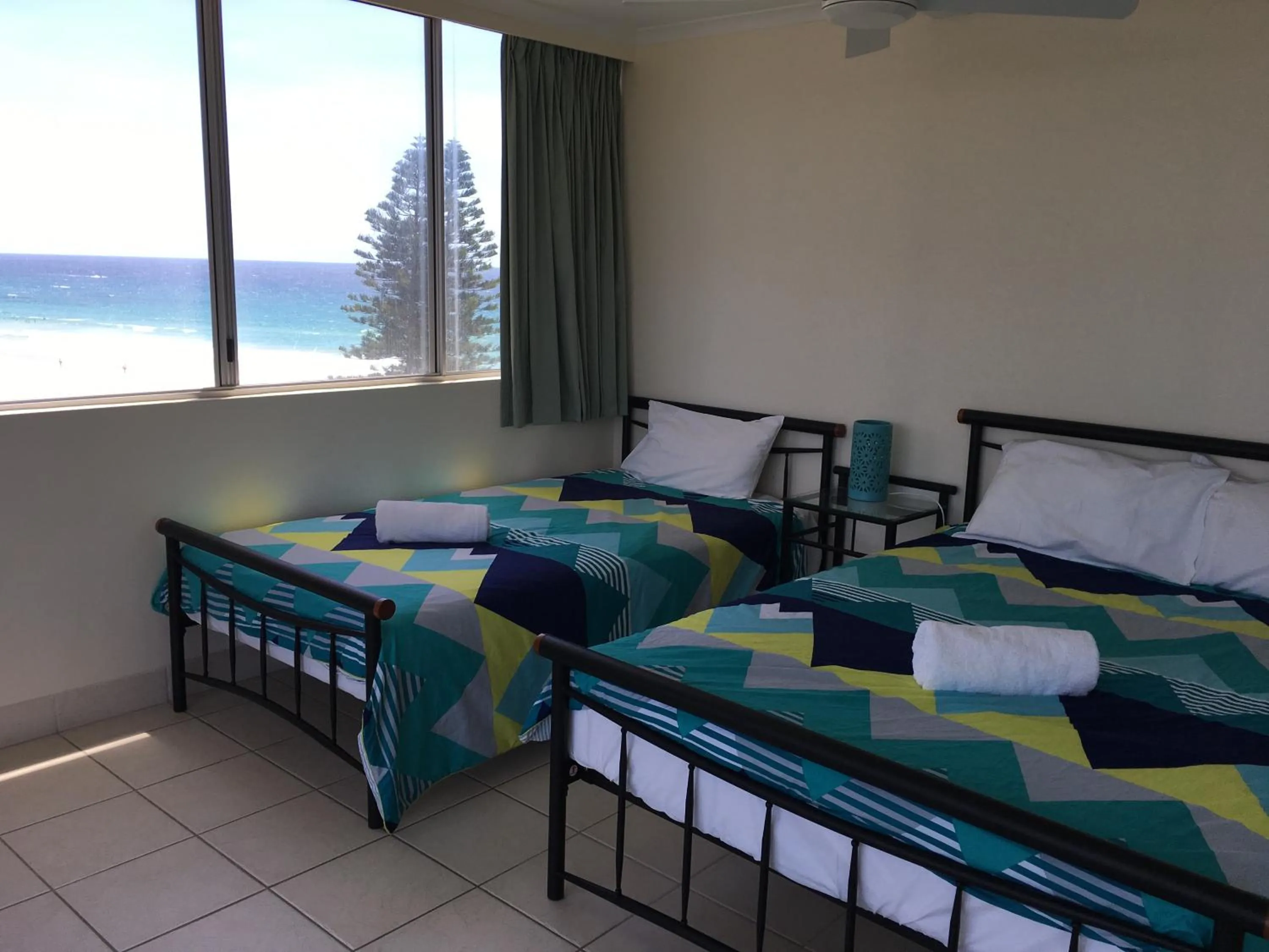 Bed in The Penthouses Apartments