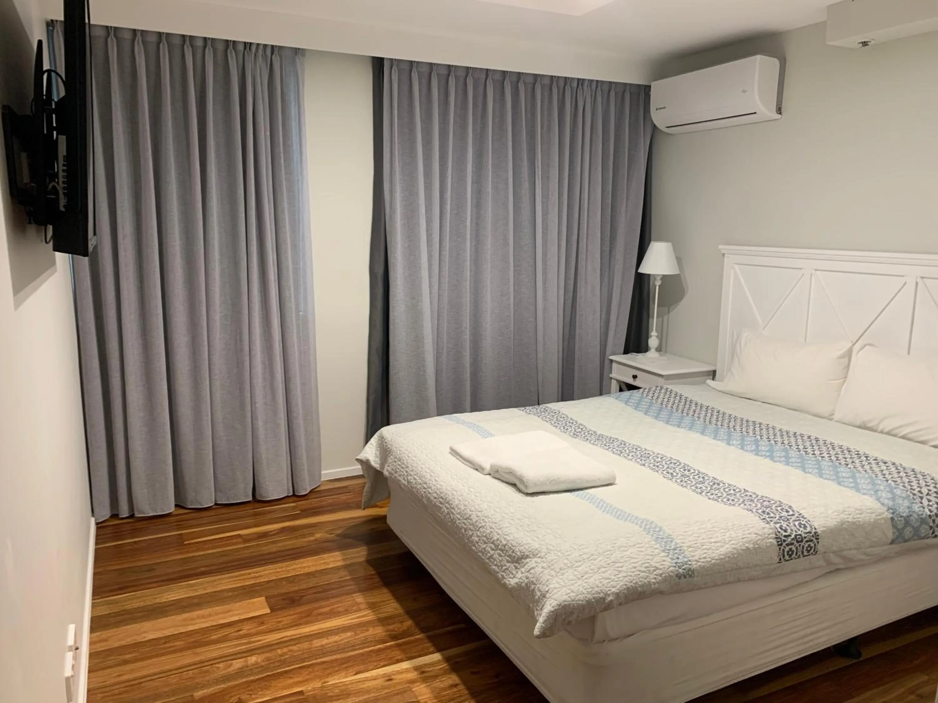 Bed in The Penthouses Apartments