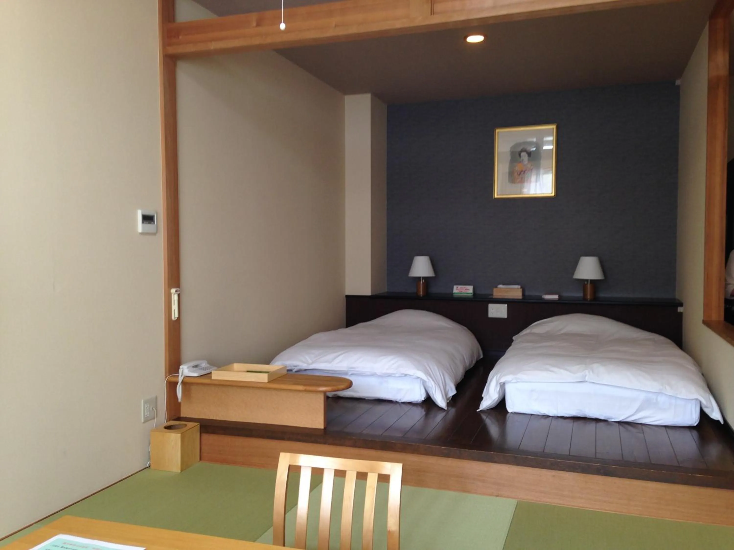 Bed in Nozawa Grand Hotel