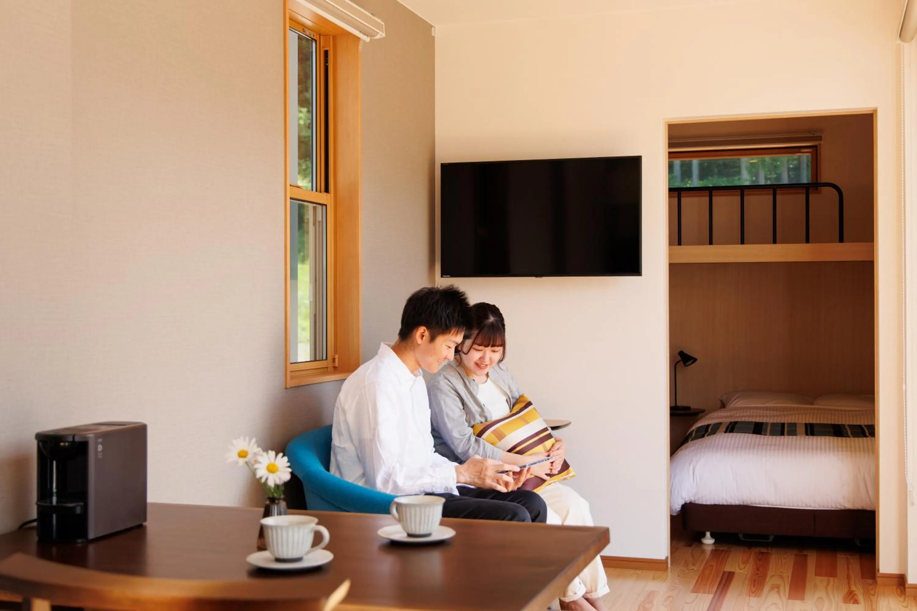 Living room, Bed in Hakuba Highland Hotel