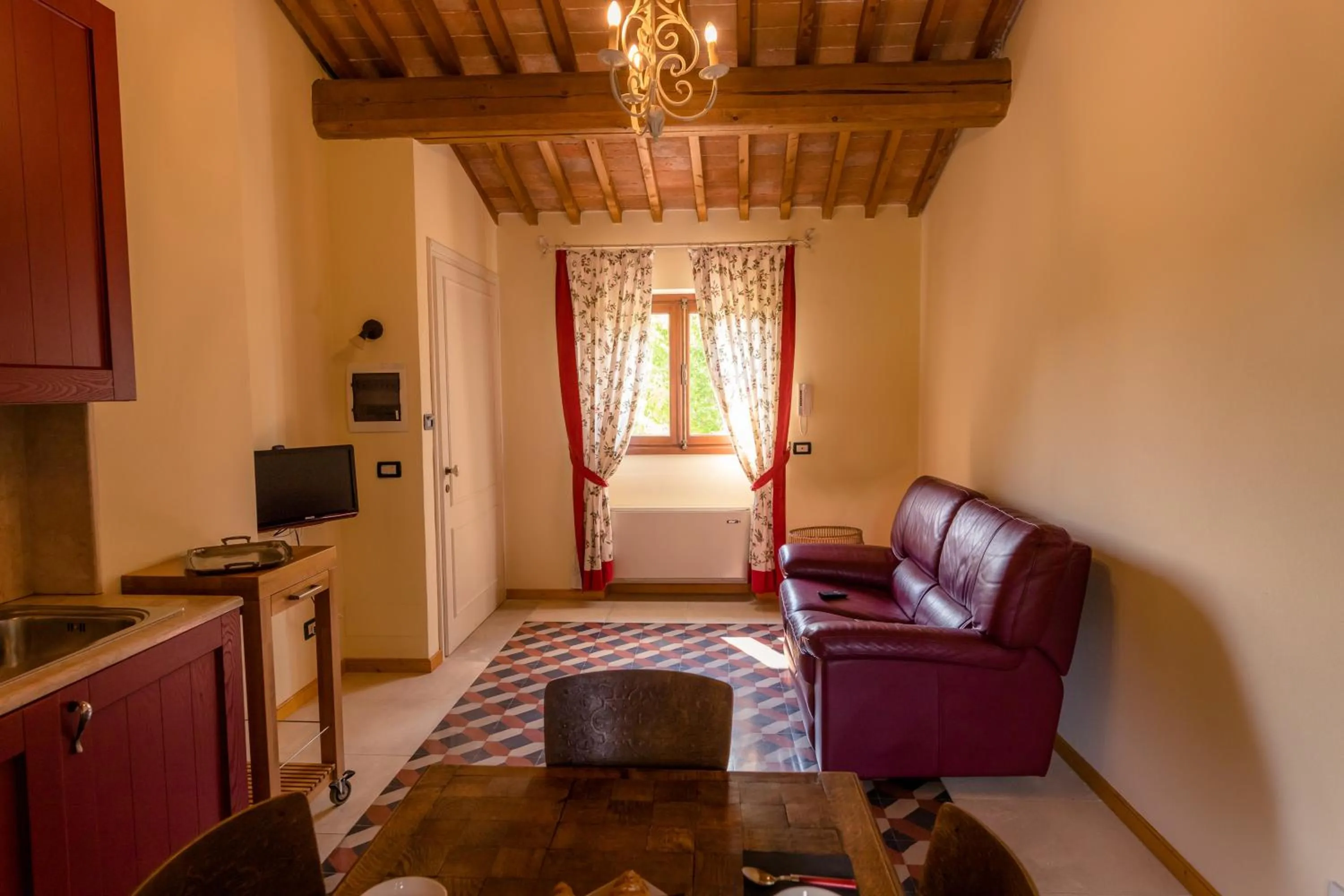 Communal lounge/ TV room in Villa Nichesola