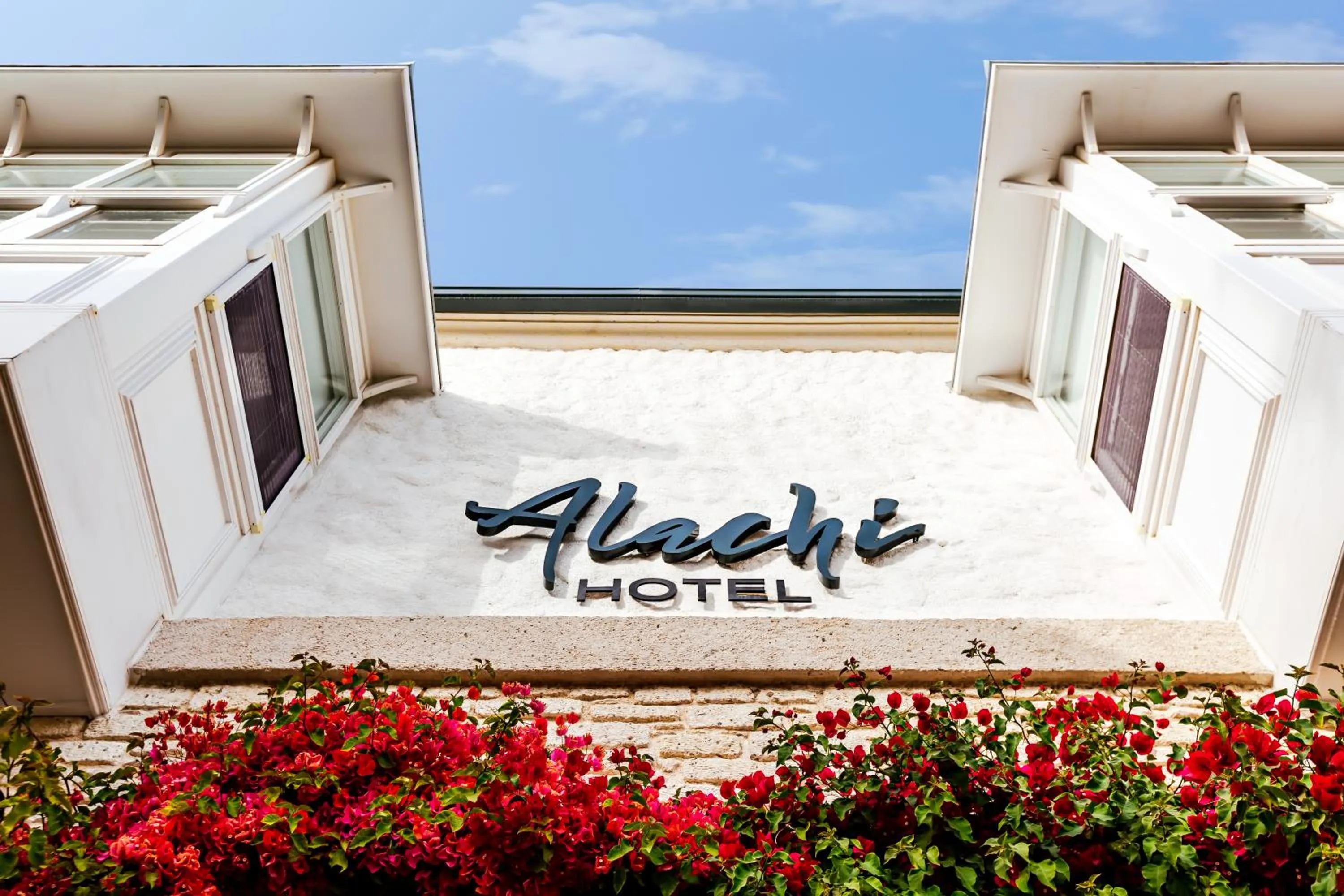 Property logo or sign in Alachi Hotel