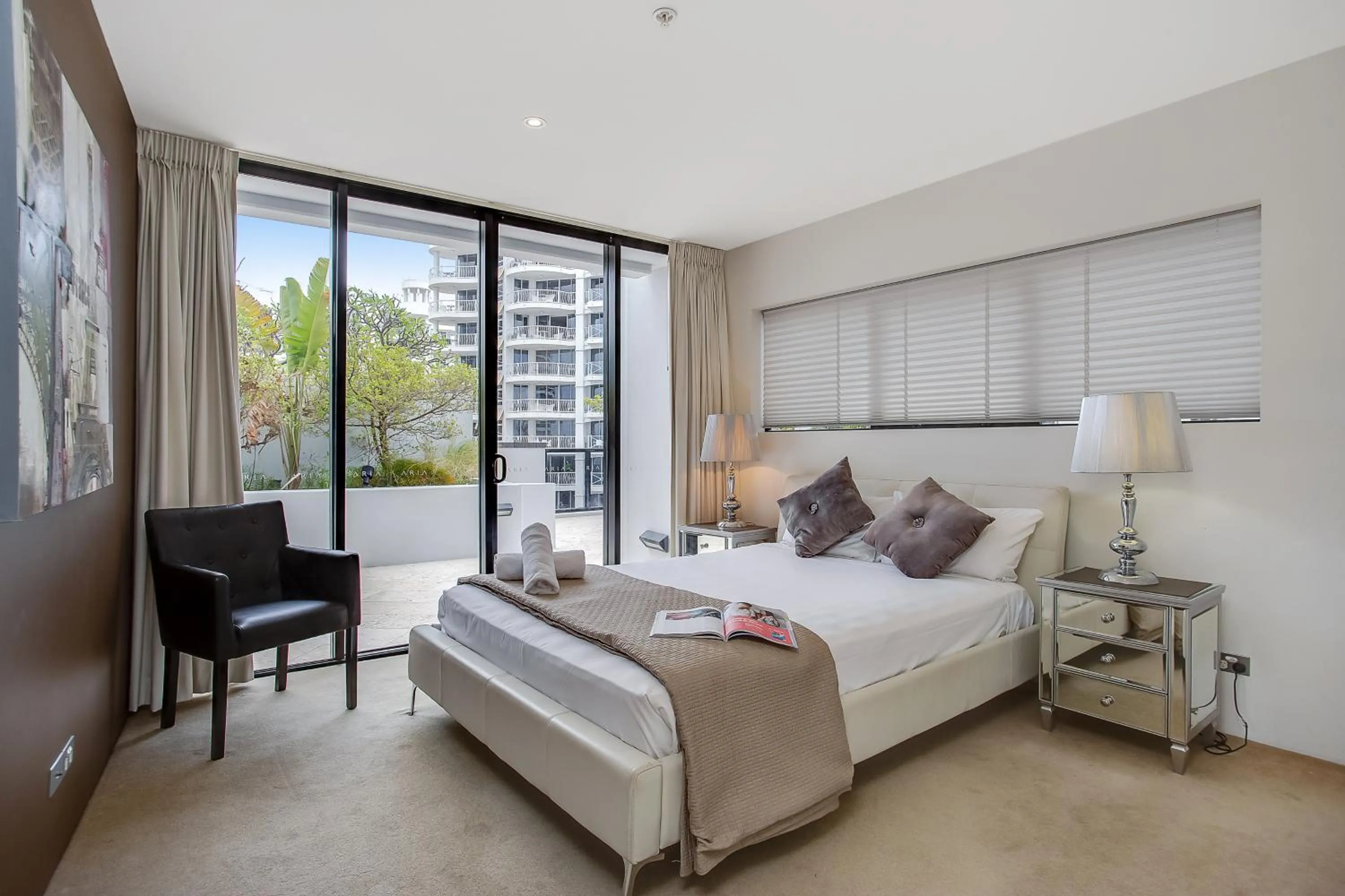 Bed in Aria Apartments