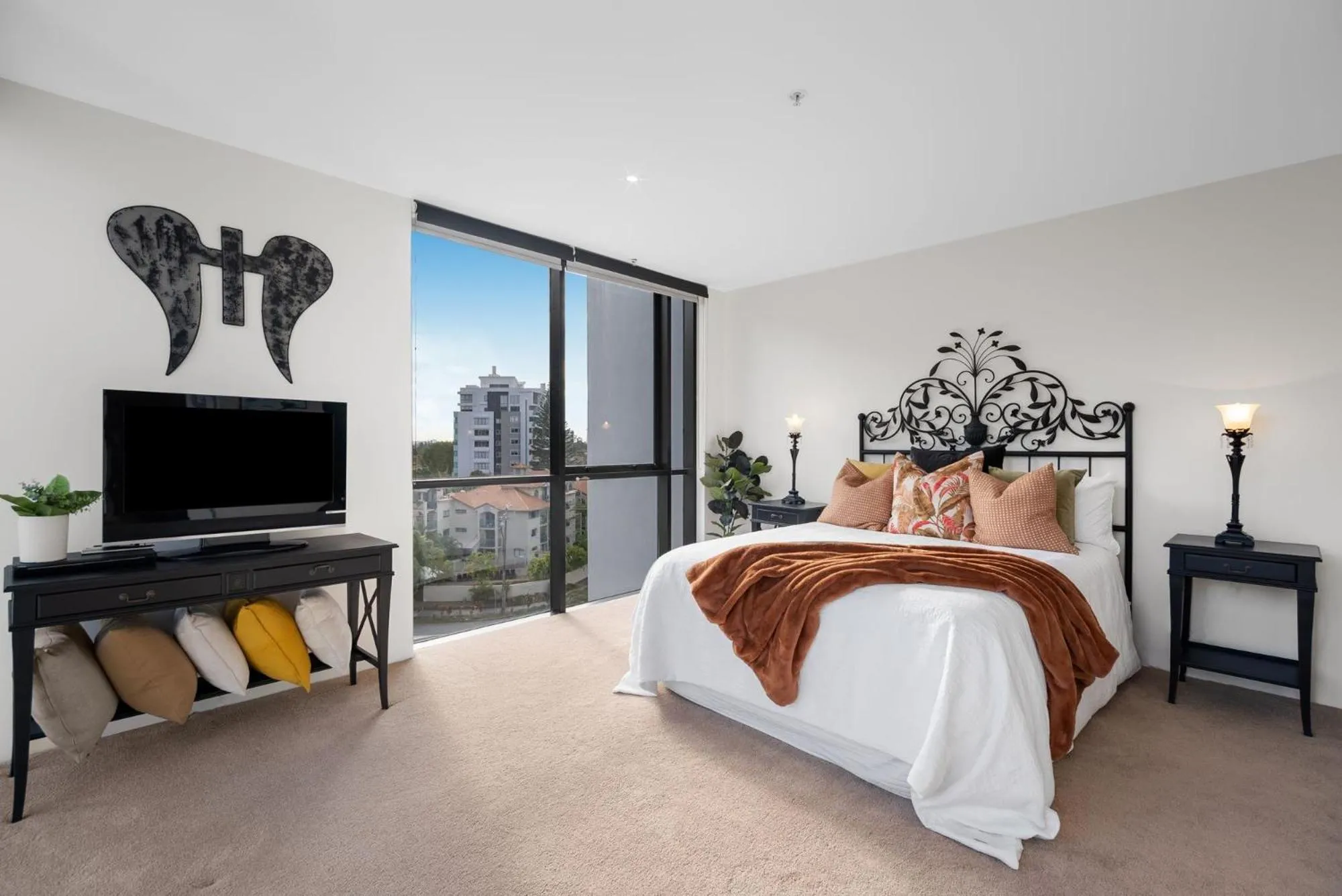 Bed in Aria Apartments