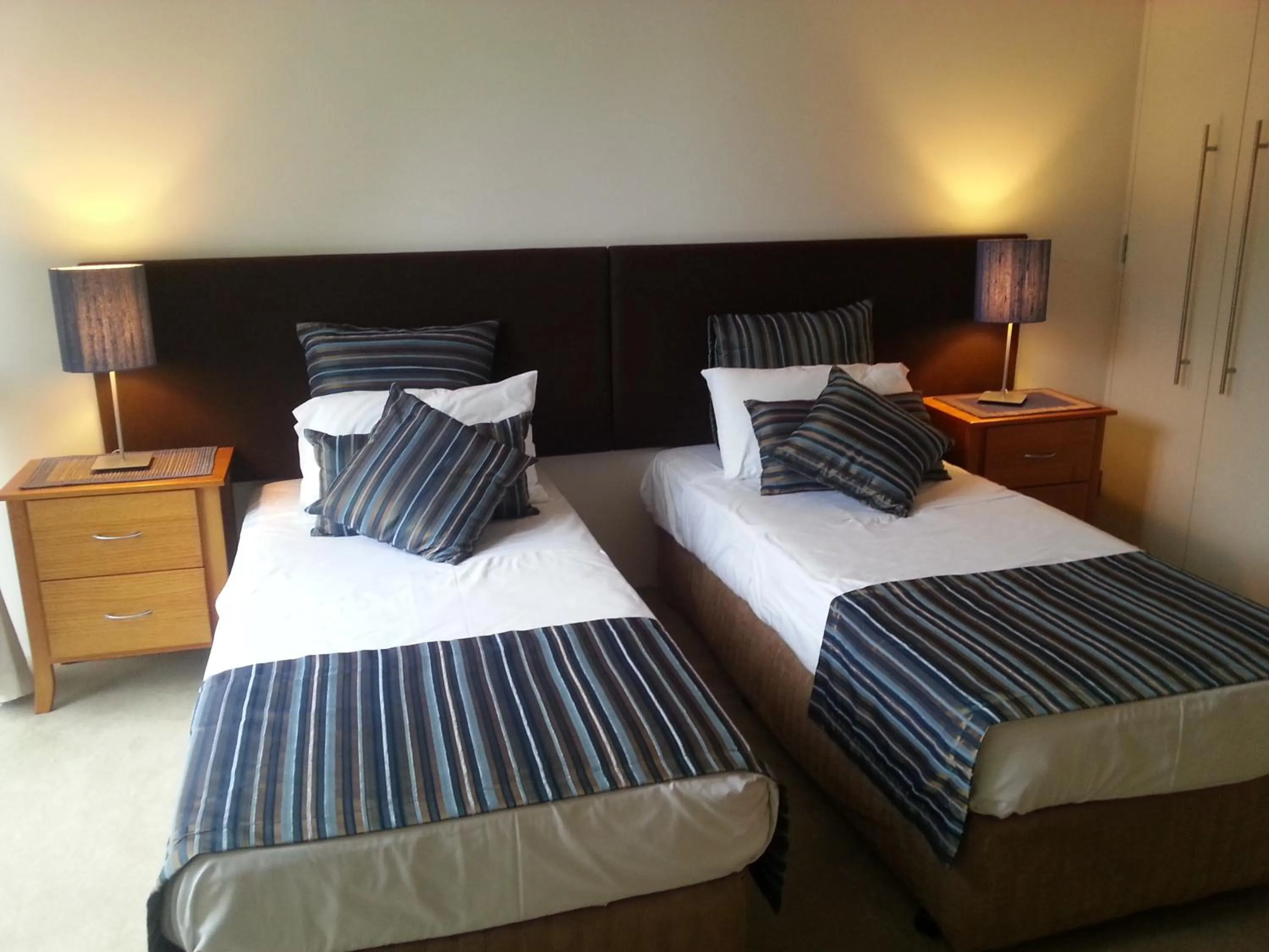 Bed in Aria Apartments