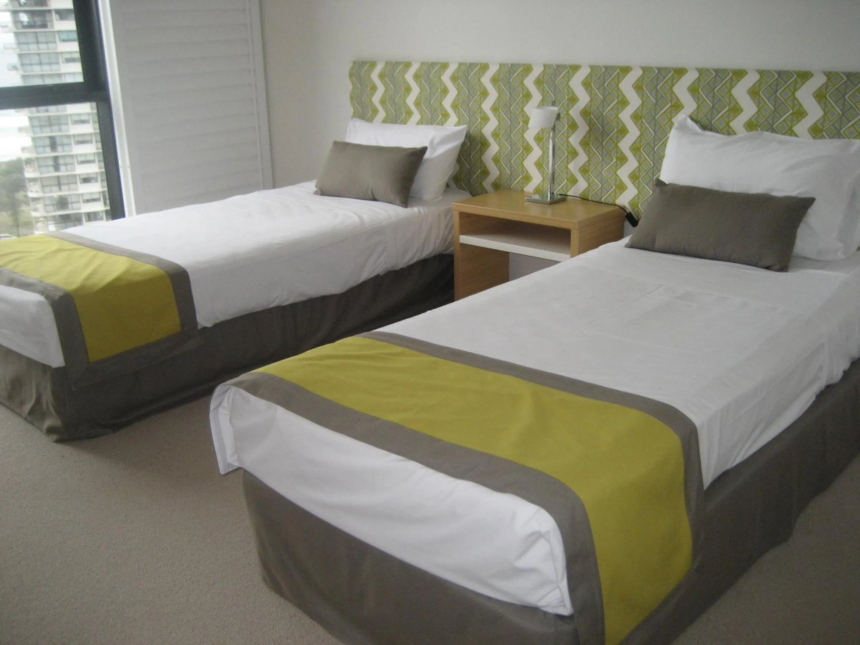 Bed in Aria Apartments