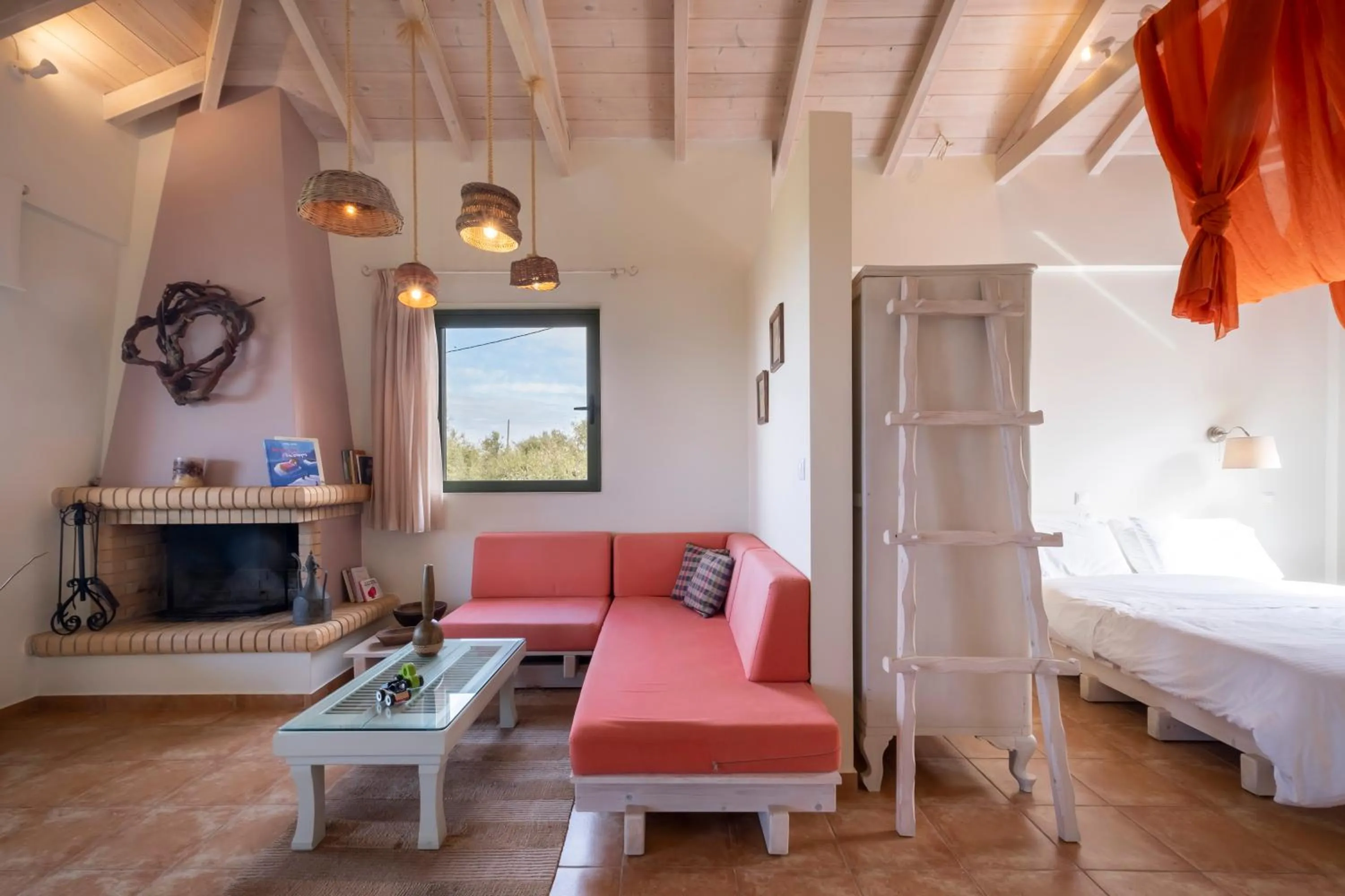 Seating area, Bed in Chamaloni Cottages